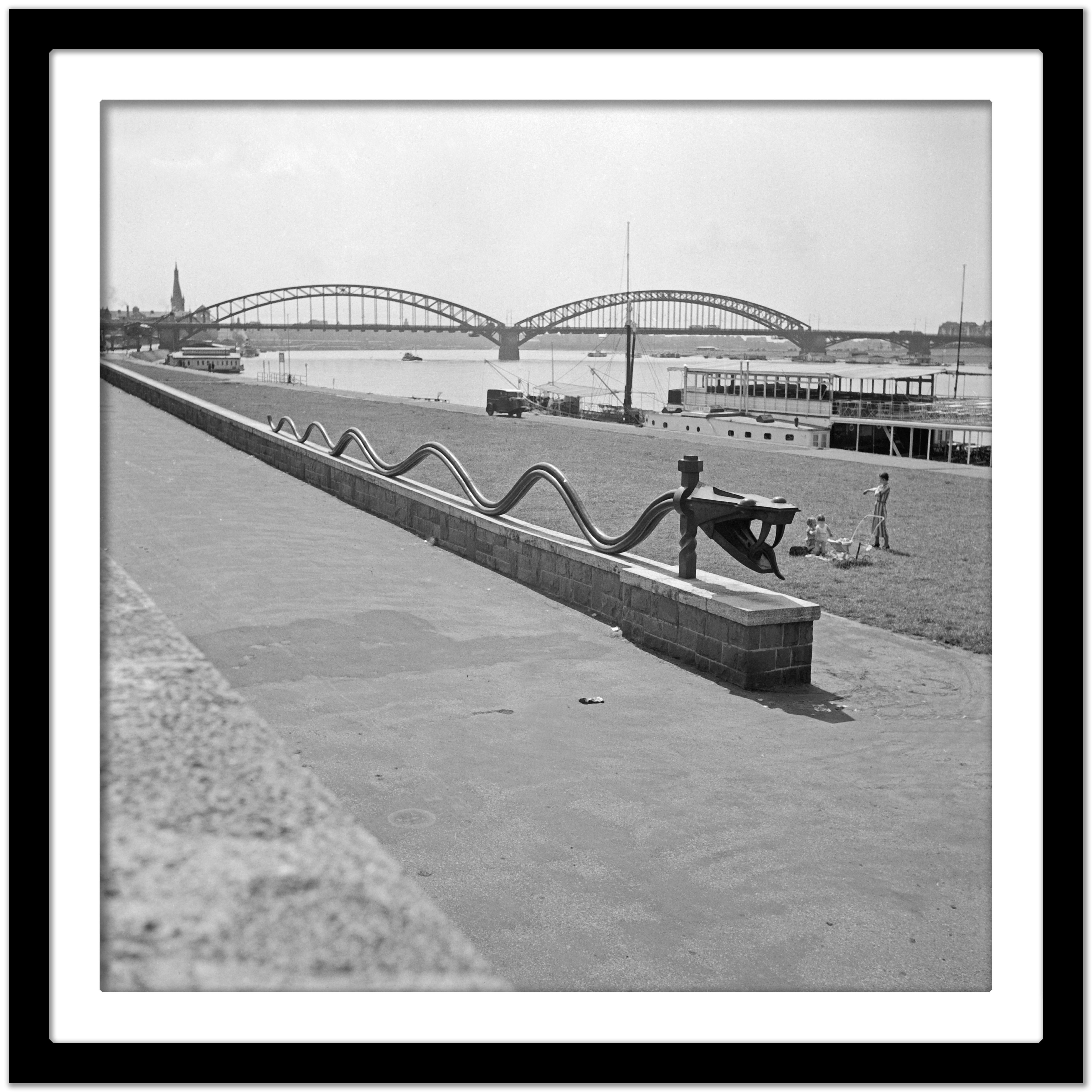 Rhine snake sculpture at shore of Rhine Duesseldorf, Germany 1937 Printed Later  - Gray Black and White Photograph by Karl Heinrich Lämmel