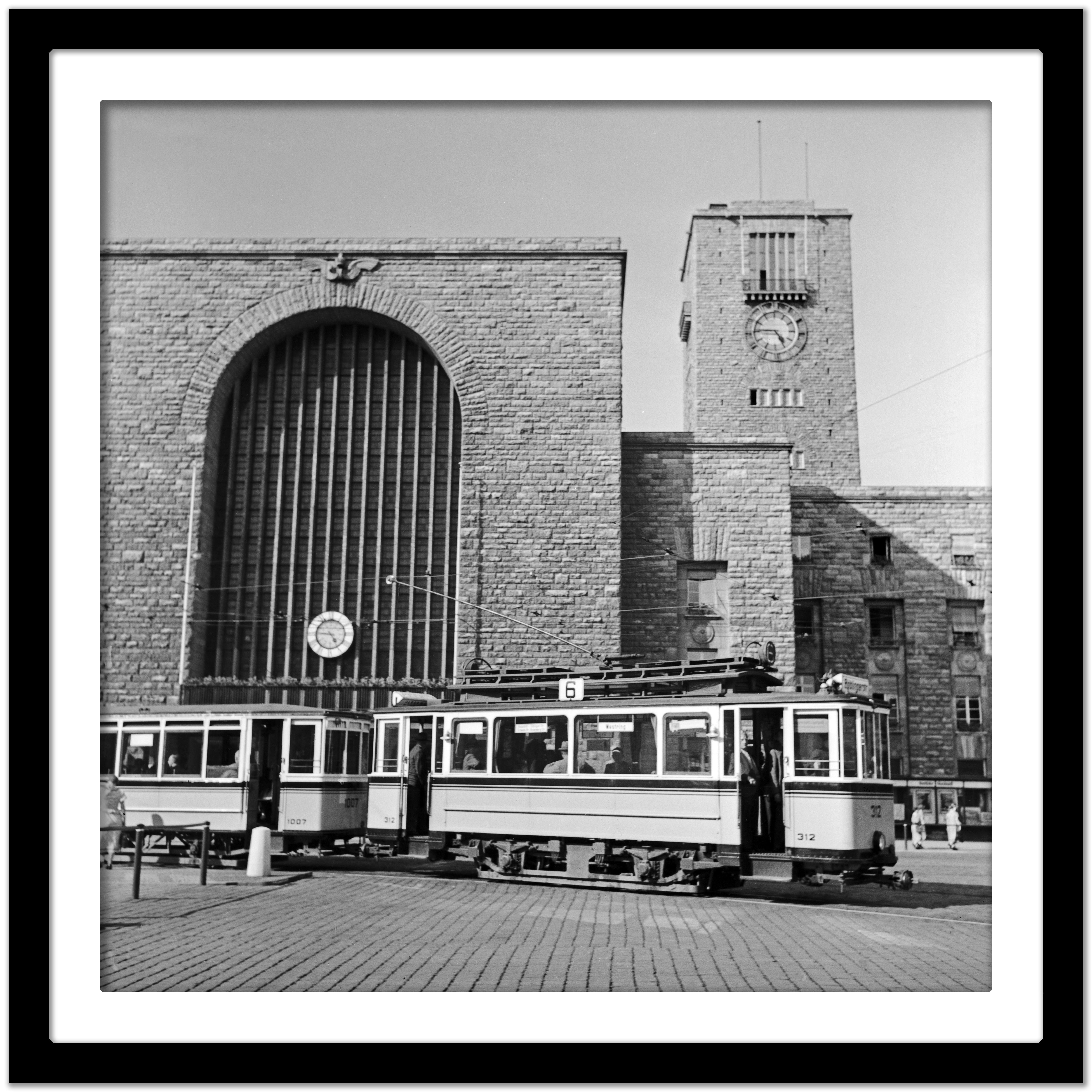 Tram line no. 6 in front of main station, Stuttgart Germany 1935, Printed Later - Gray Black and White Photograph by Karl Heinrich Lämmel