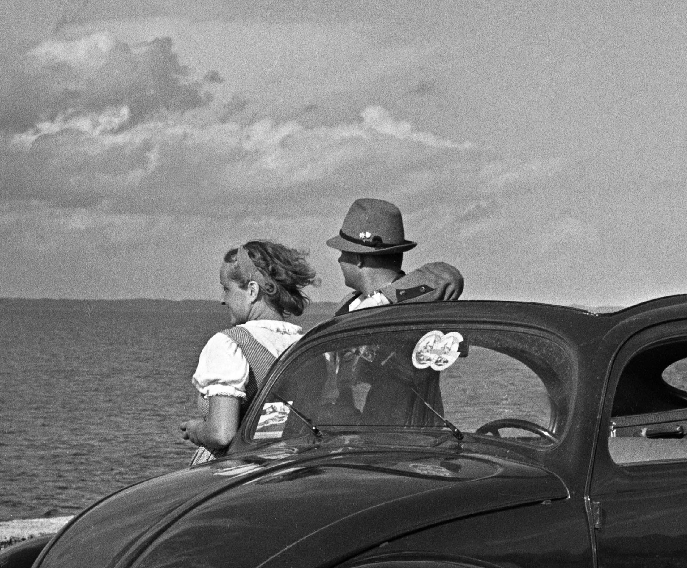 Traveling to the seaside in the Volkswagen beetle, Germany 1937 Printed Later  - Photograph by Karl Heinrich Lämmel