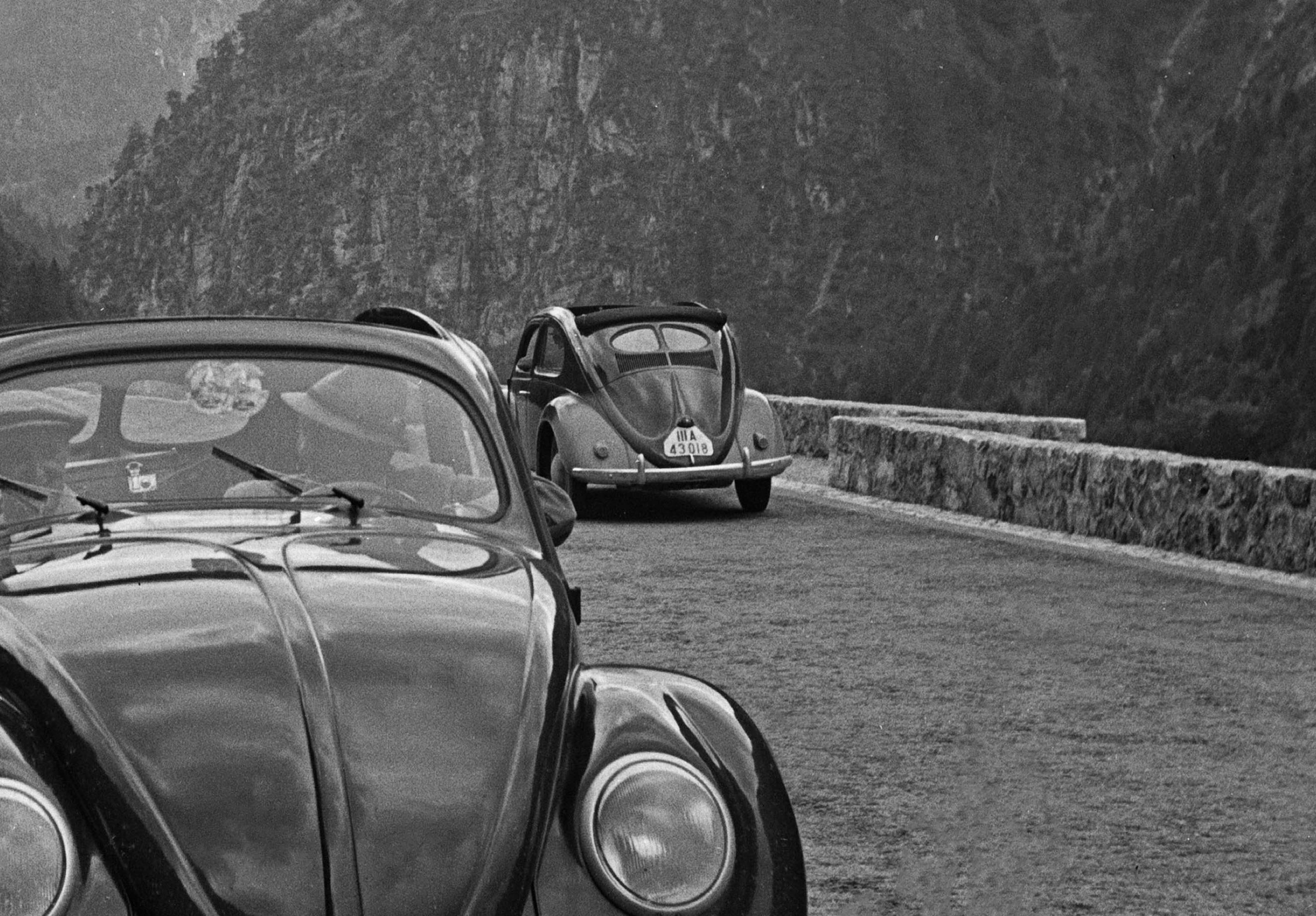 Travelling by Volkswagen beetle through mountains, Germany 1939 Printed Later  - Photograph by Karl Heinrich Lämmel