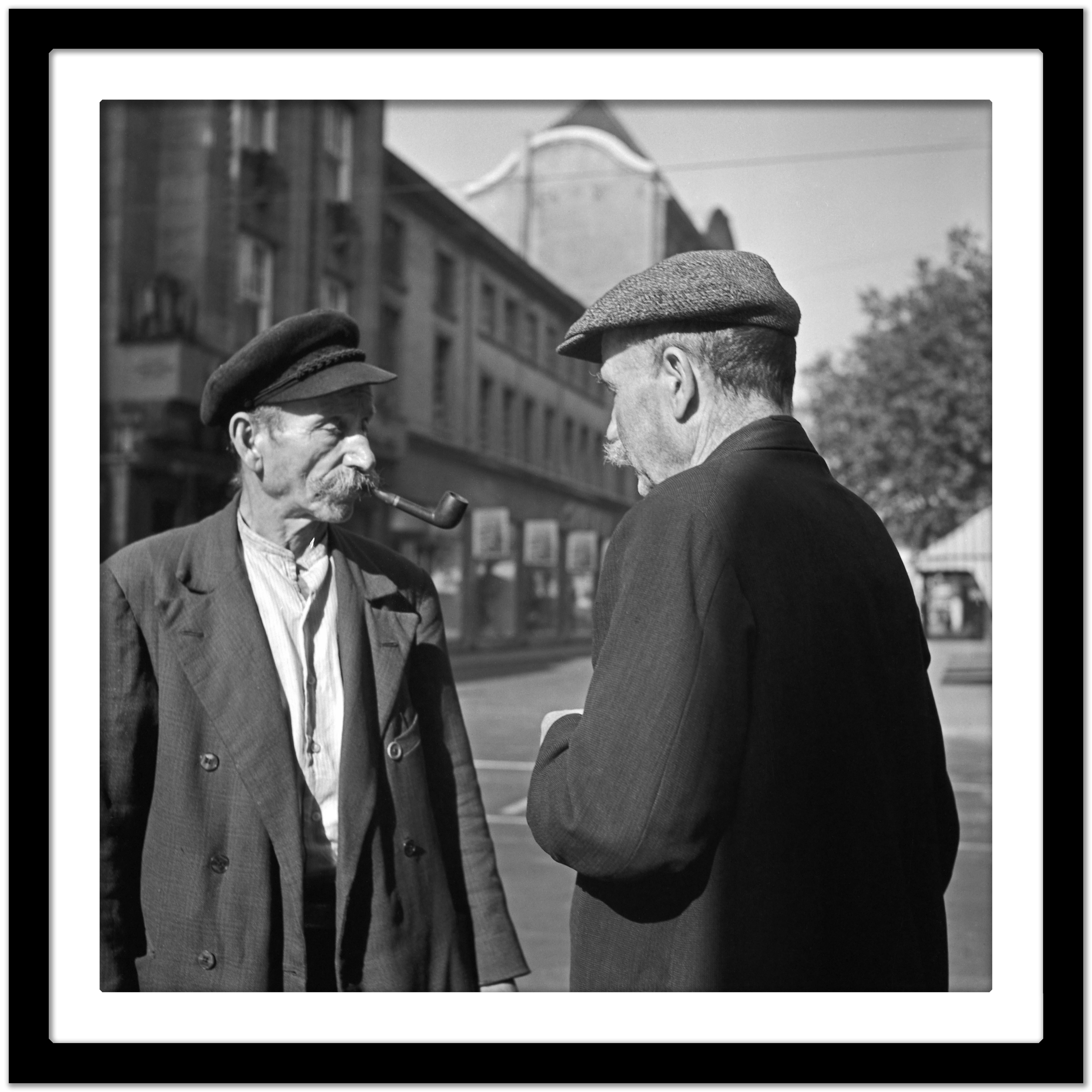Two elder men having a chat at Duesseldorf, Germany 1937 Printed Later  - Modern Photograph by Karl Heinrich Lämmel