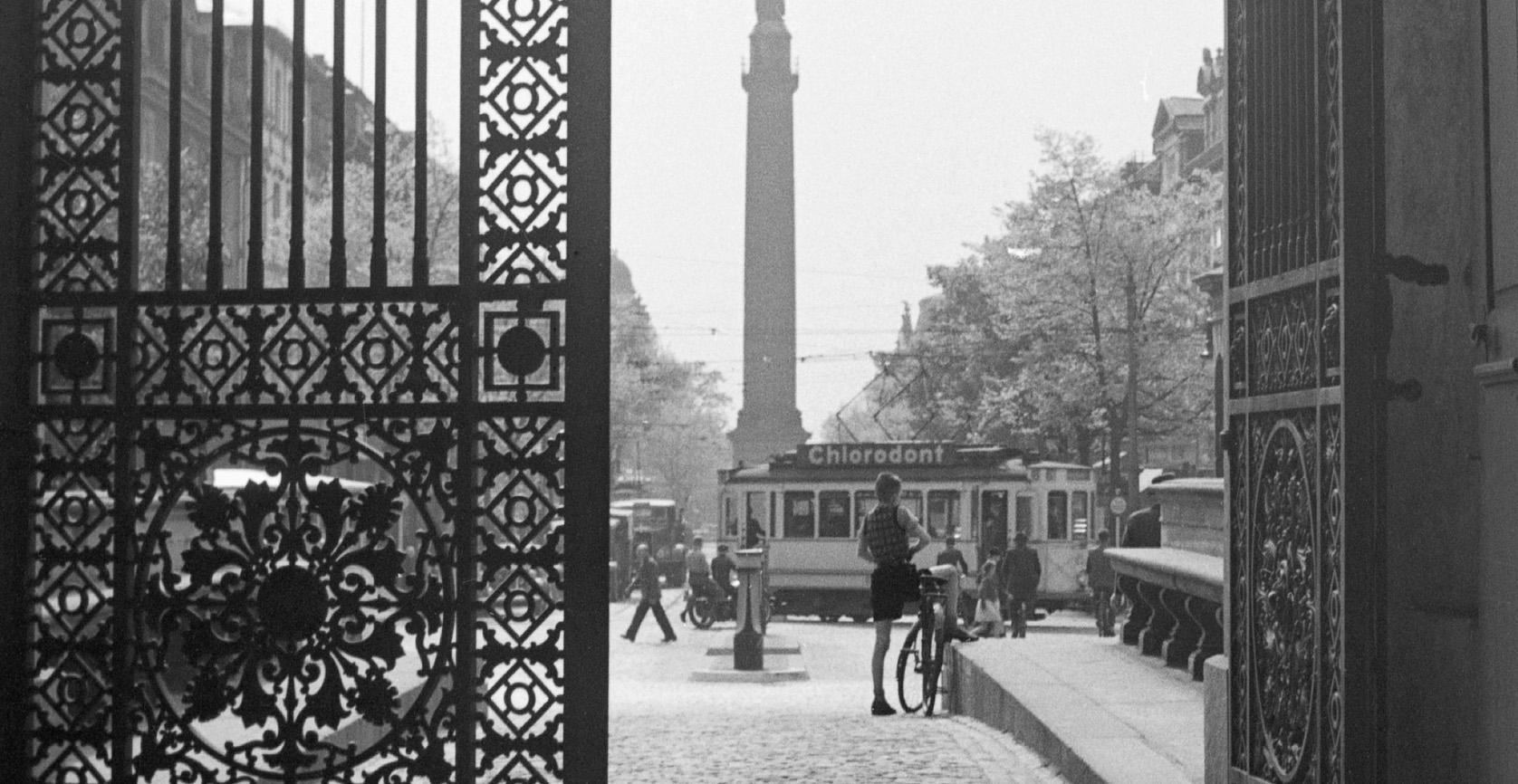 View from iron gate to city life Darmstadt, Germany 1938 Printed Later  - Photograph by Karl Heinrich Lämmel