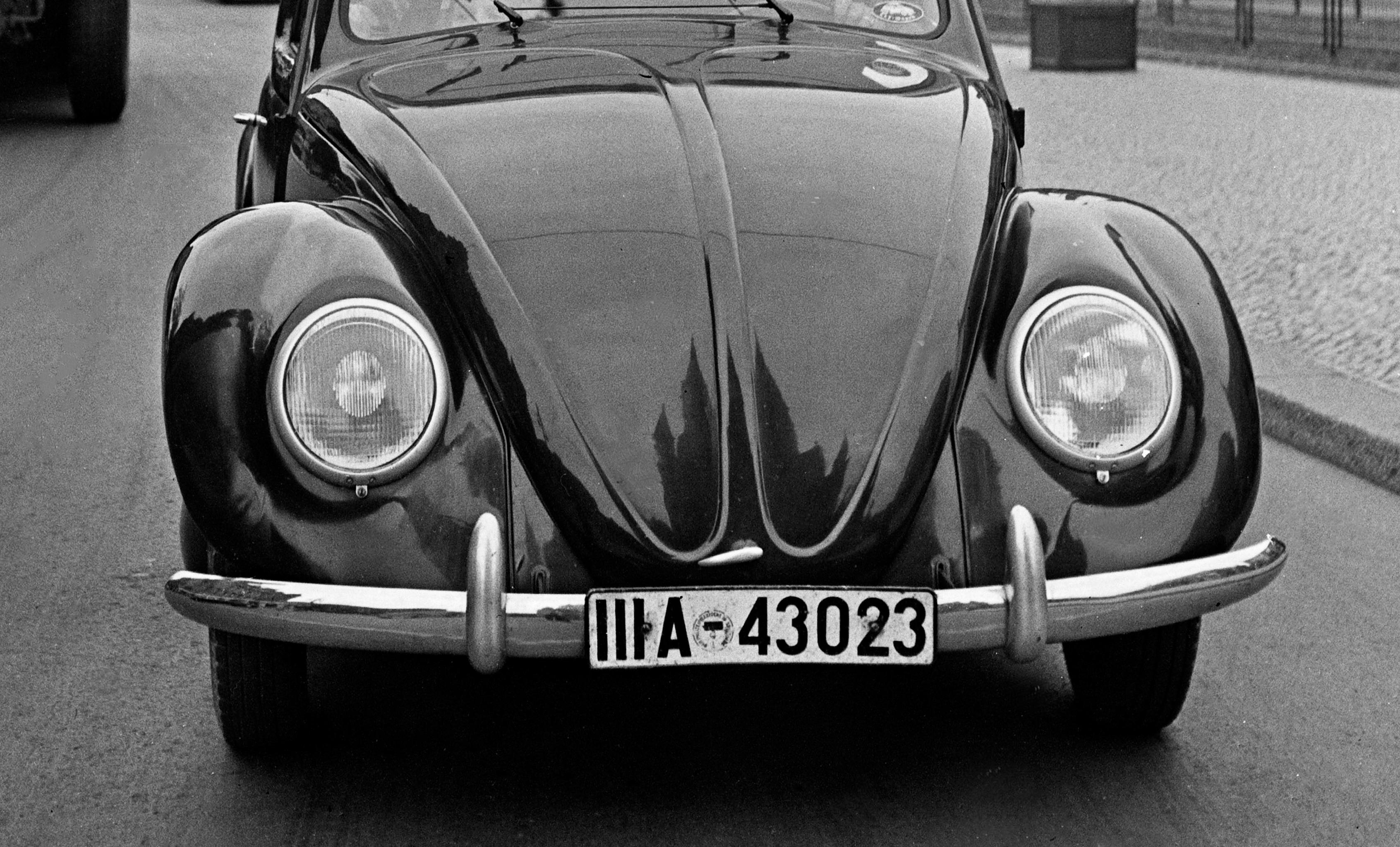 Volkswagen beetle on the streets in Berlin, Germany 1939 Printed Later  - Photograph by Karl Heinrich Lämmel