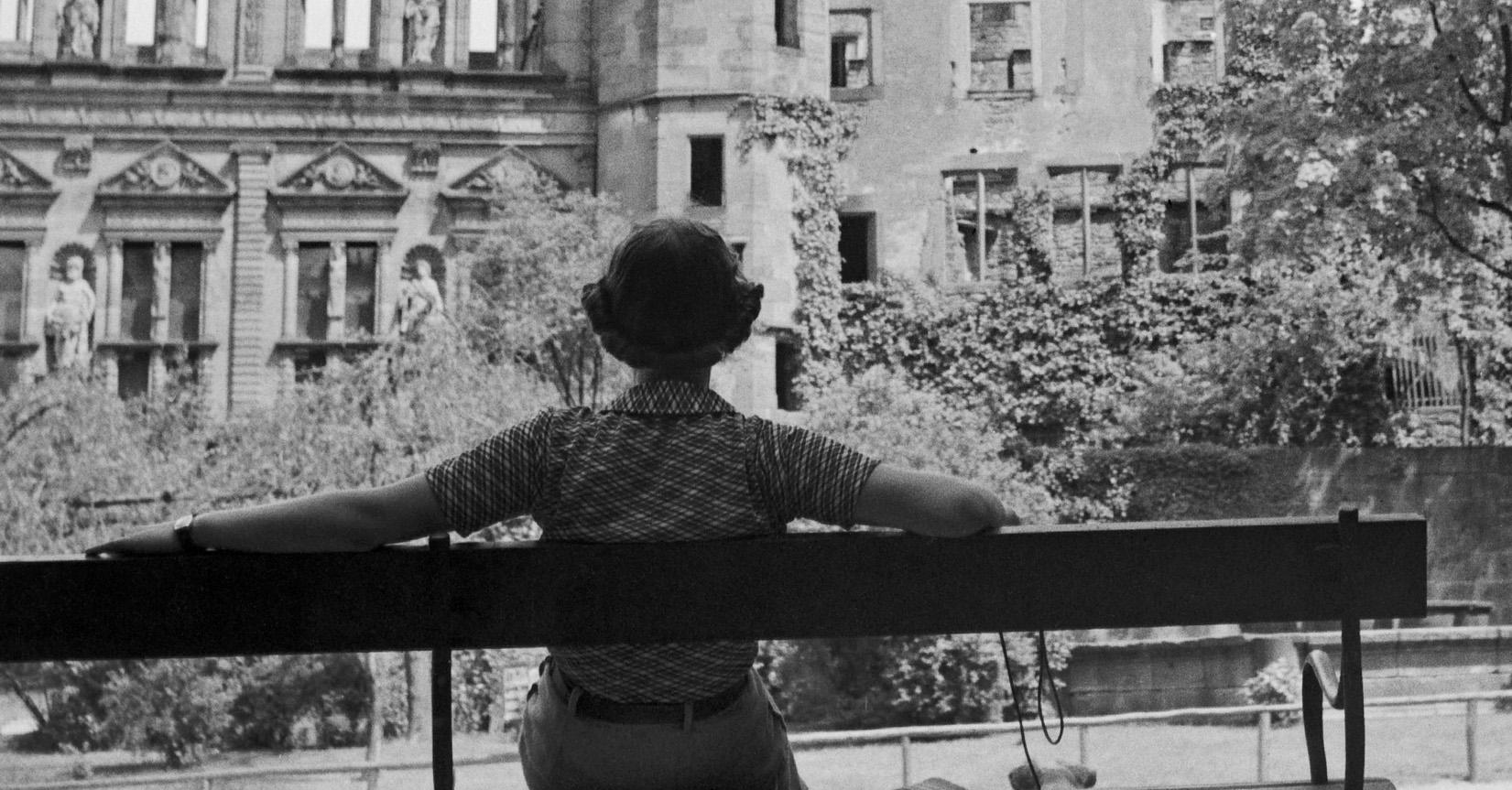 Woman on bench in front of Heidelberg castle, Germany 1936, Printed Later  - Photograph by Karl Heinrich Lämmel