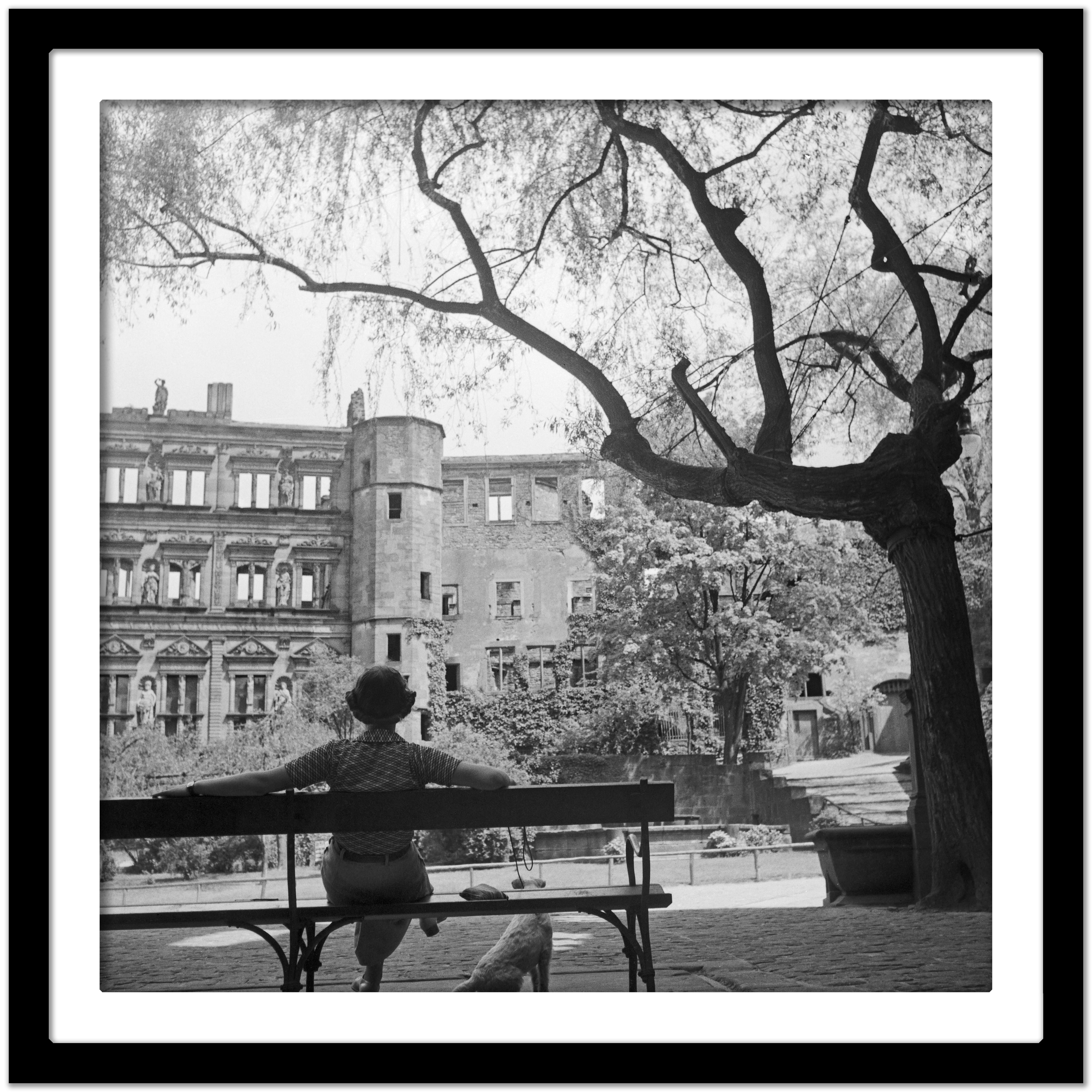 Woman on bench in front of Heidelberg castle, Germany 1936, Printed Later  - Gray Black and White Photograph by Karl Heinrich Lämmel