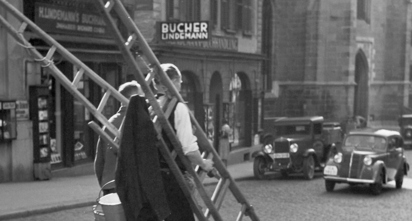 Workers crossing the street, Stuttgart Germany 1935, Printed Later - Photograph by Karl Heinrich Lämmel