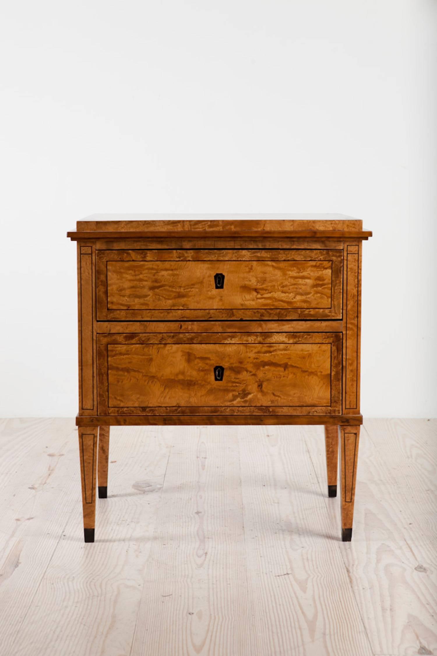 Karl Johan commode with two drawers, birchwood with ebonized inlay, origin: Sweden, circa 1840. A great night table and side table.

The Biedermeier or Karl Johan Period in Sweden dates to circa 1820-1850. Named in Sweden after King Carl XIV