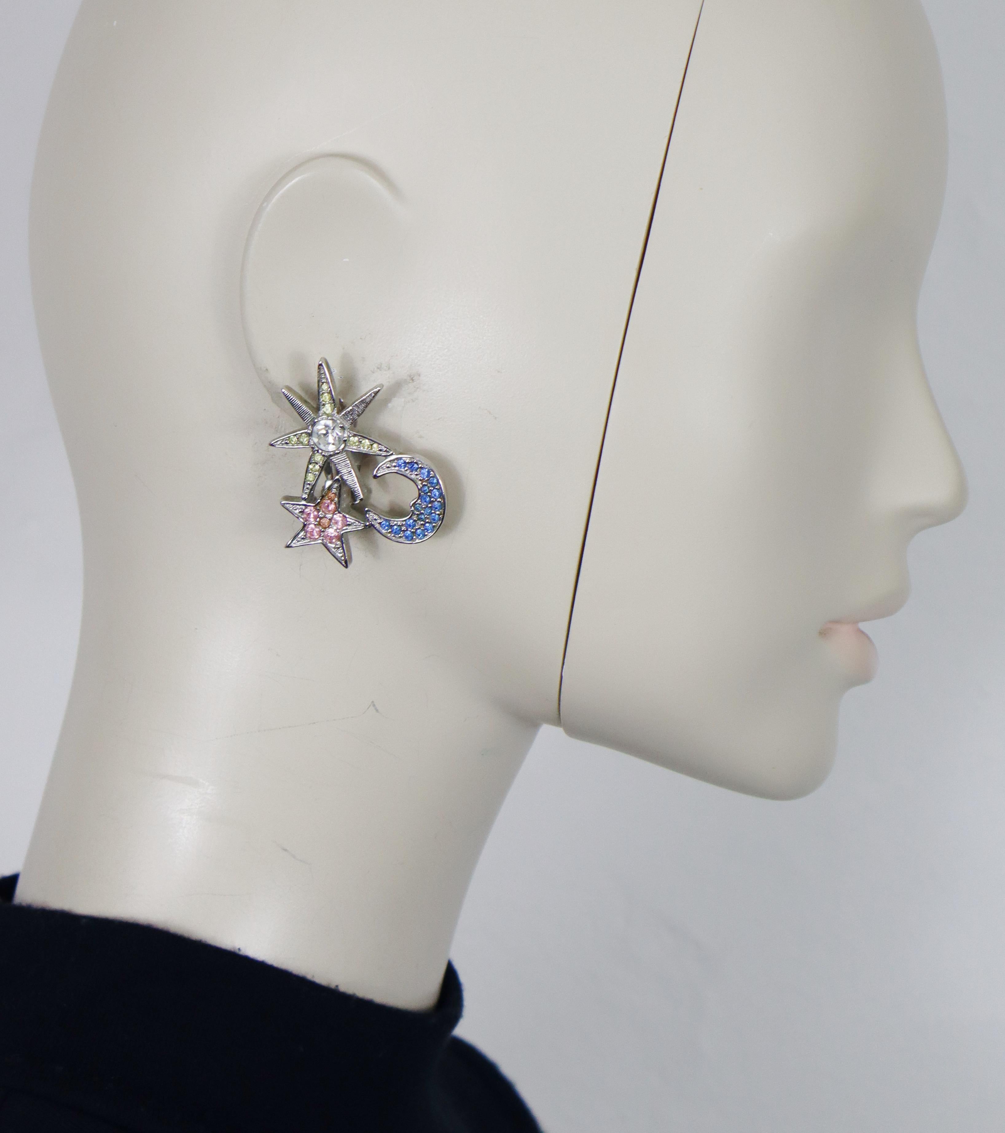 KARL LAGERFELD vintage silver tone clip-on earrings featuring a crescent moon, a sun and a star embellished with multicolored crystals (yellow, blue, pink, clear).

Embossed KL on the reverse sides.

Indicative measurements : max. height approx. 4.2