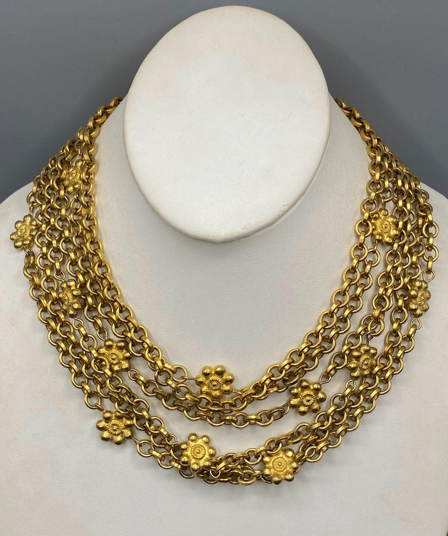 A wonderful 1980s six strand short necklace by famous designer Karl Lagerfeld. In 1983 Lagerfeld joined the house of Chanel as head designer. In 1984, he launched his own label. Presented is a six strand satin gold chain necklace from the mid to