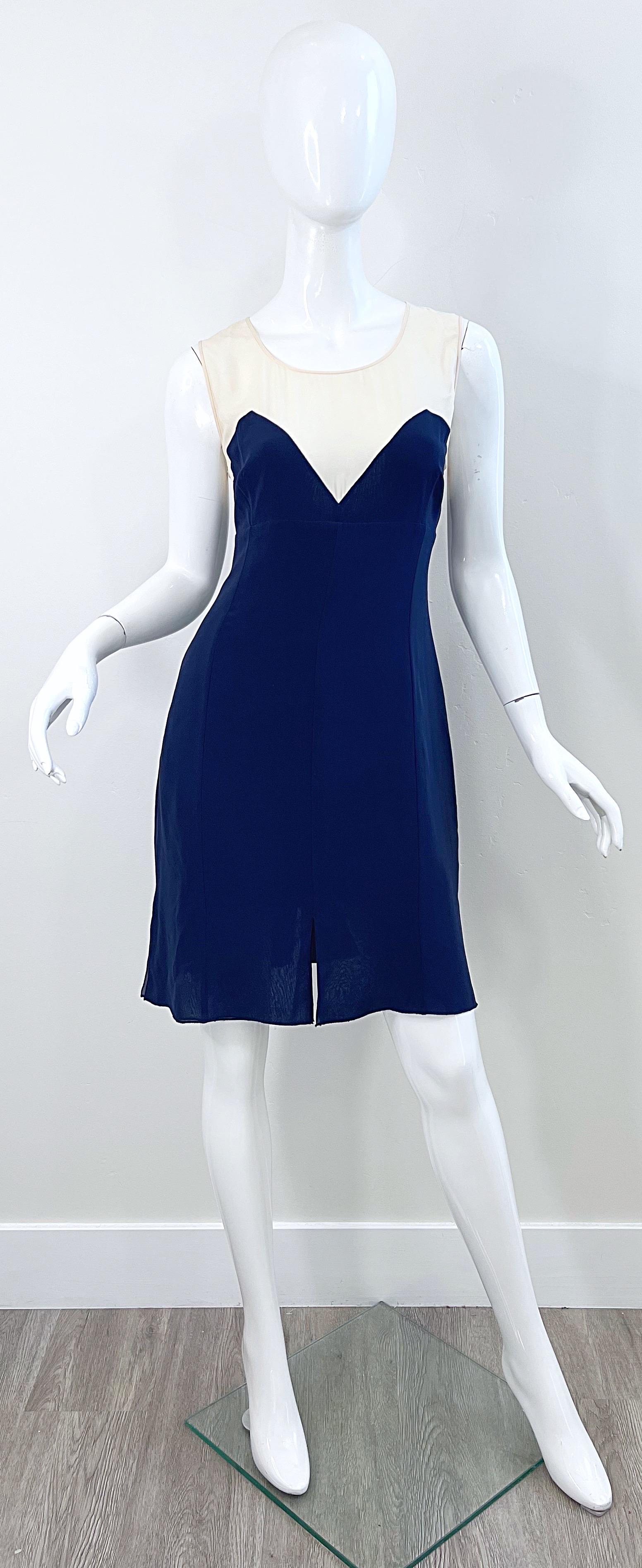 Beautiful late 80s KARL LAGERFELD navy + ivory silk chiffon sleeveless dress. Features a navy body with semi sheer ivory above the bust. Hidden zipper up the back with hook-and-eye closure. Button closure at top back neck. Multiple layers of chiffon