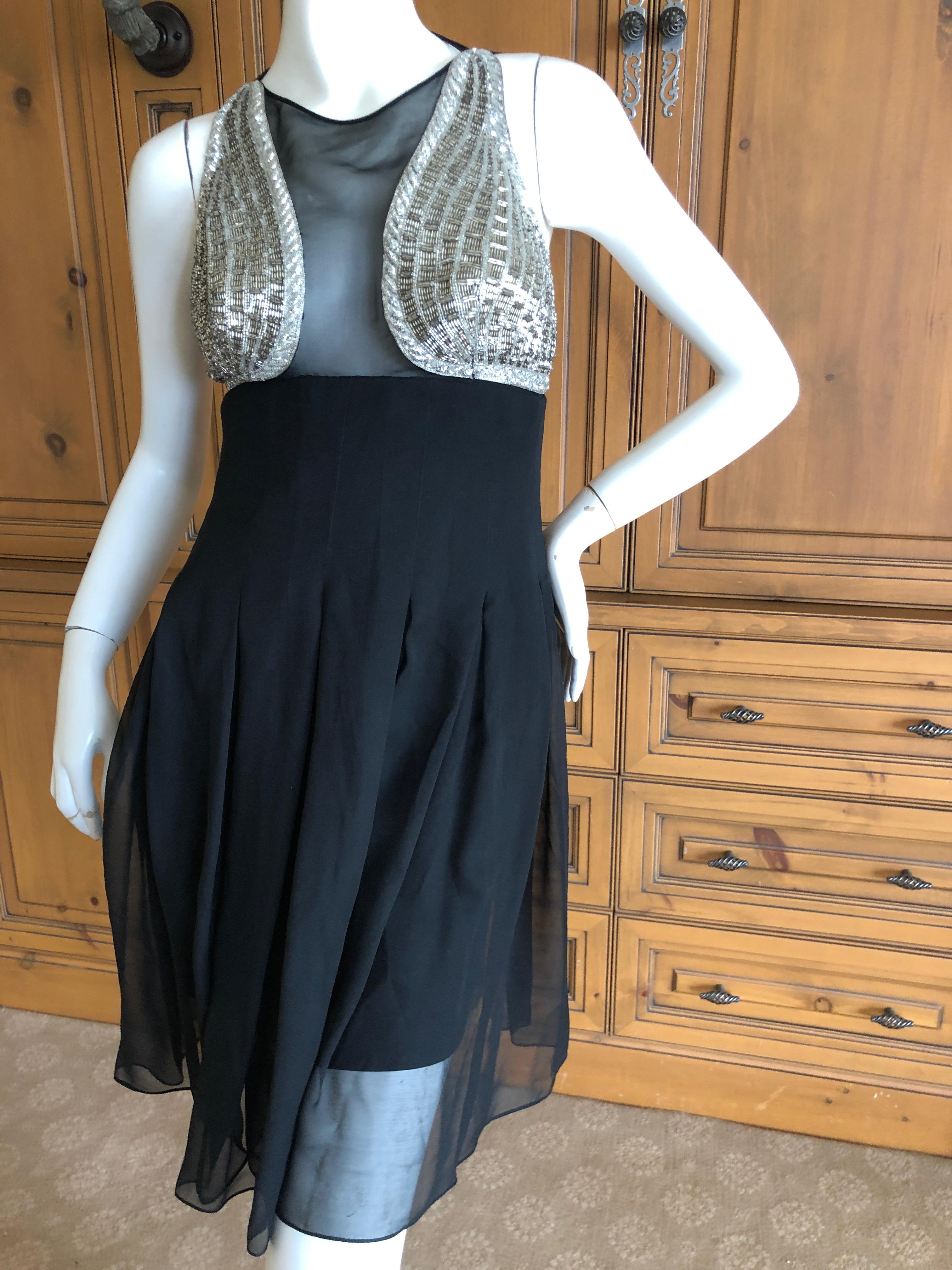 Karl Lagerfeld 1984 Lesage Embellished Babydoll Dress.
In 1984, fresh from his success as being named the designer of Chanel (1983), Karl Lagerfeld put out his first signature collection, at a very high price level.
The workmanship was on par with