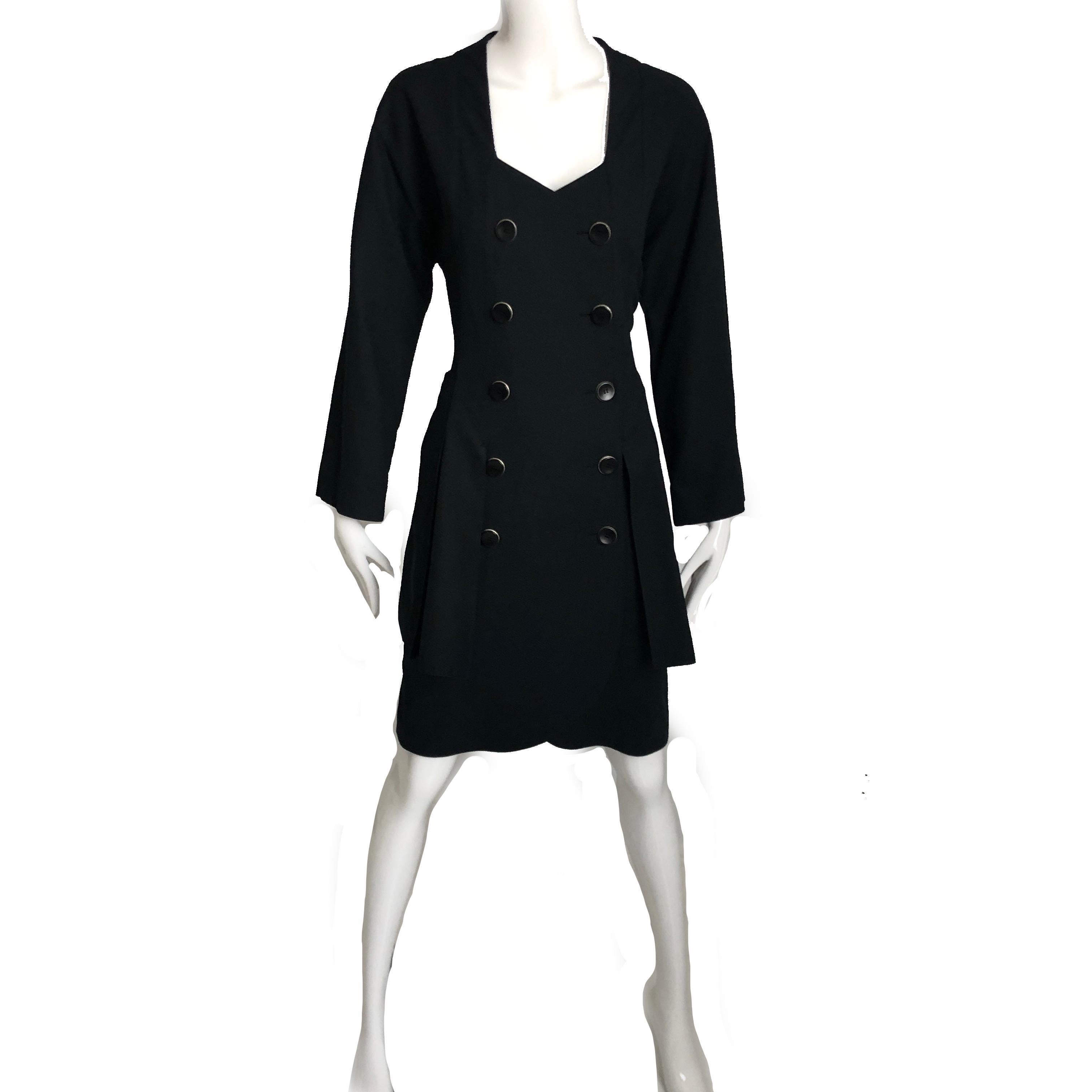 This smart suit style dress dress is from Karl Lagerfeld circa the 90s.  Made from black waffle-textured cotton, it looks like two pieces but is actually a button-wrap dress.  It features a 