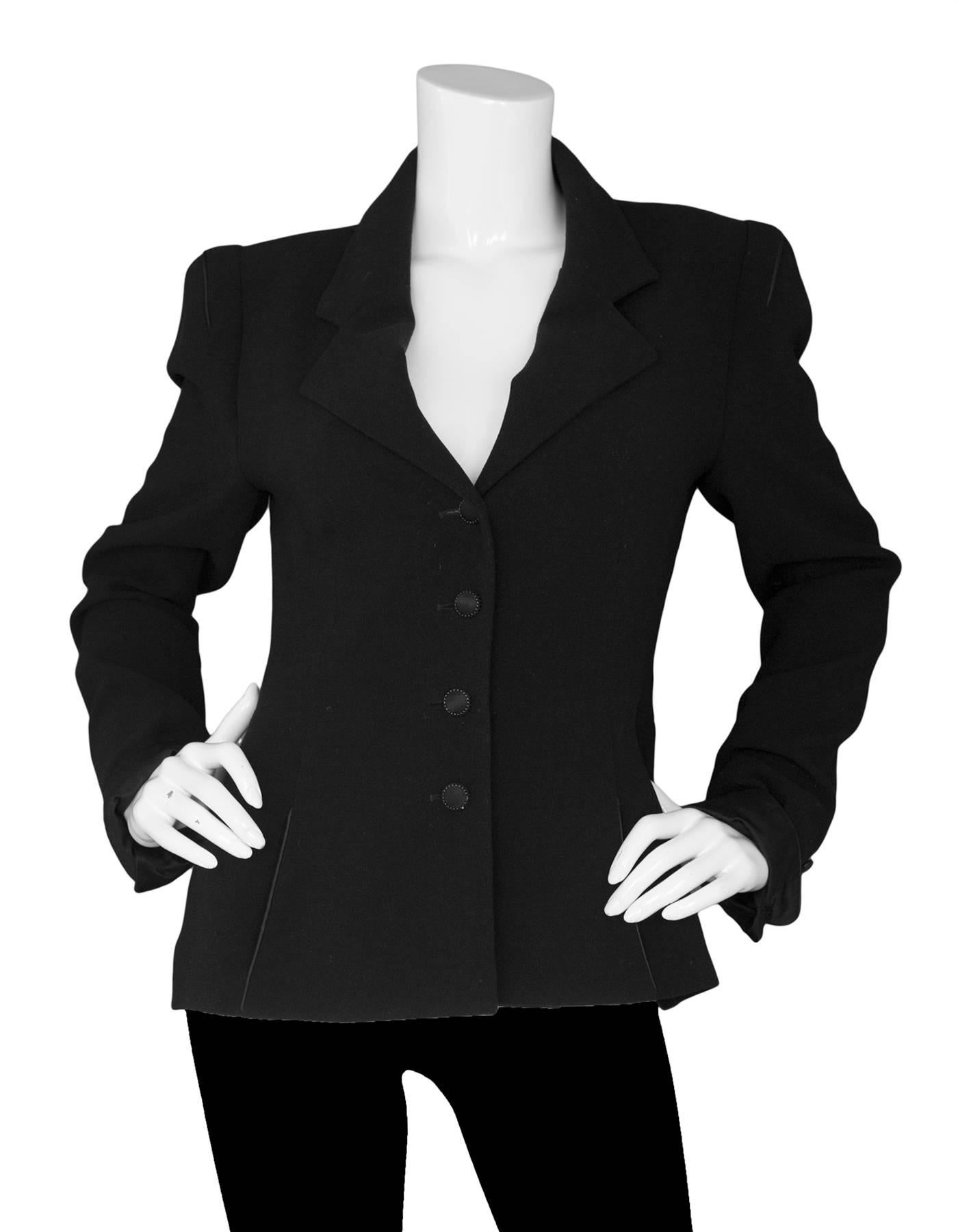 Karl Lagerfeld Black Jacket

Features satin buttons and trim with tie detail at back

Made In: France
Color: Black
Composition: Not listed, feels like wool blend
Lining: Black textile
Closure/Opening: Front button closure
Exterior Pockets: Side
