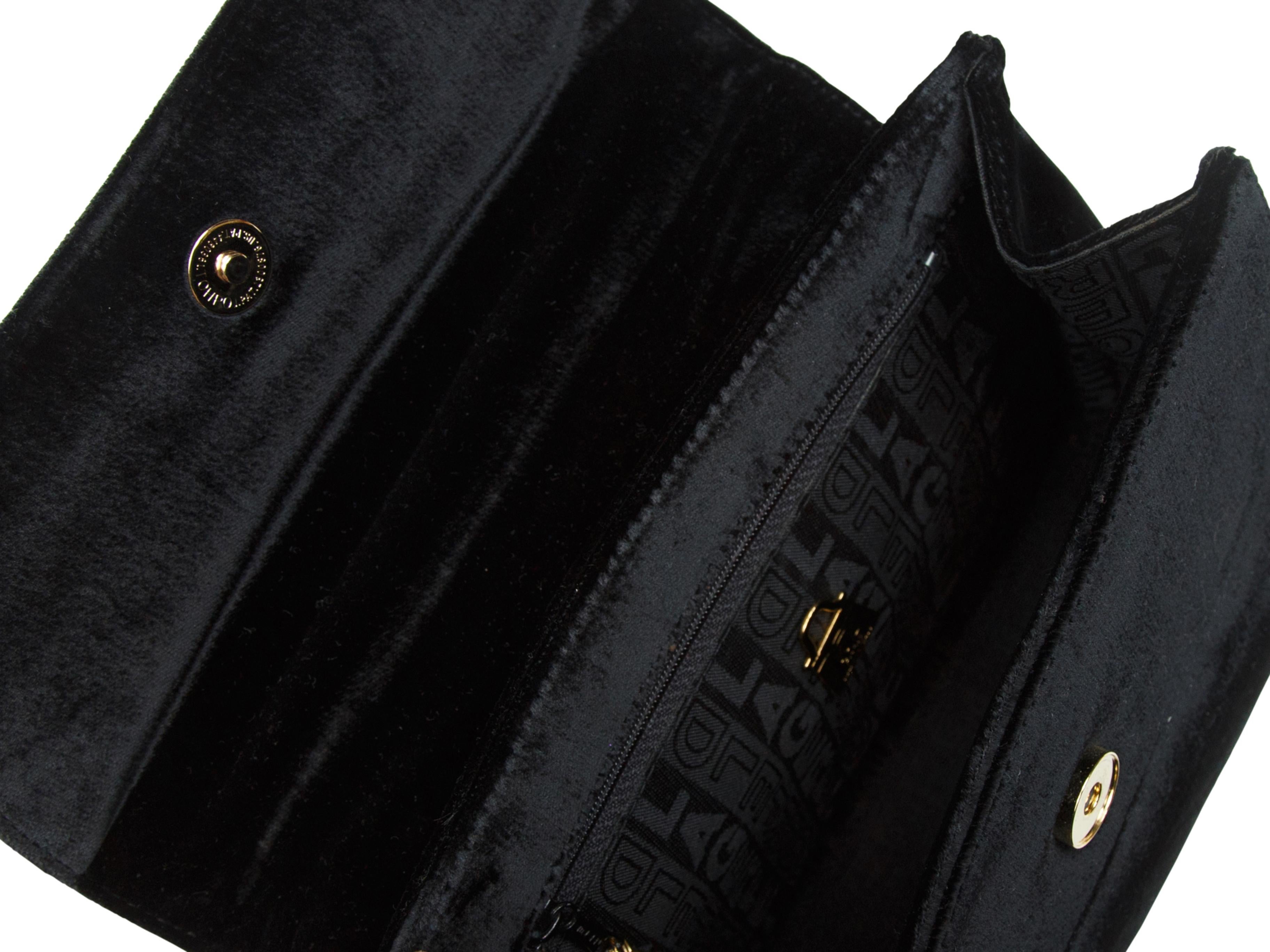 Product details: Vintage black velvet crossbody bag by Karl Lagerfeld. Gold-tone hardware. Single top handle. Detachable crossbody strap. Flap closure at front. 10