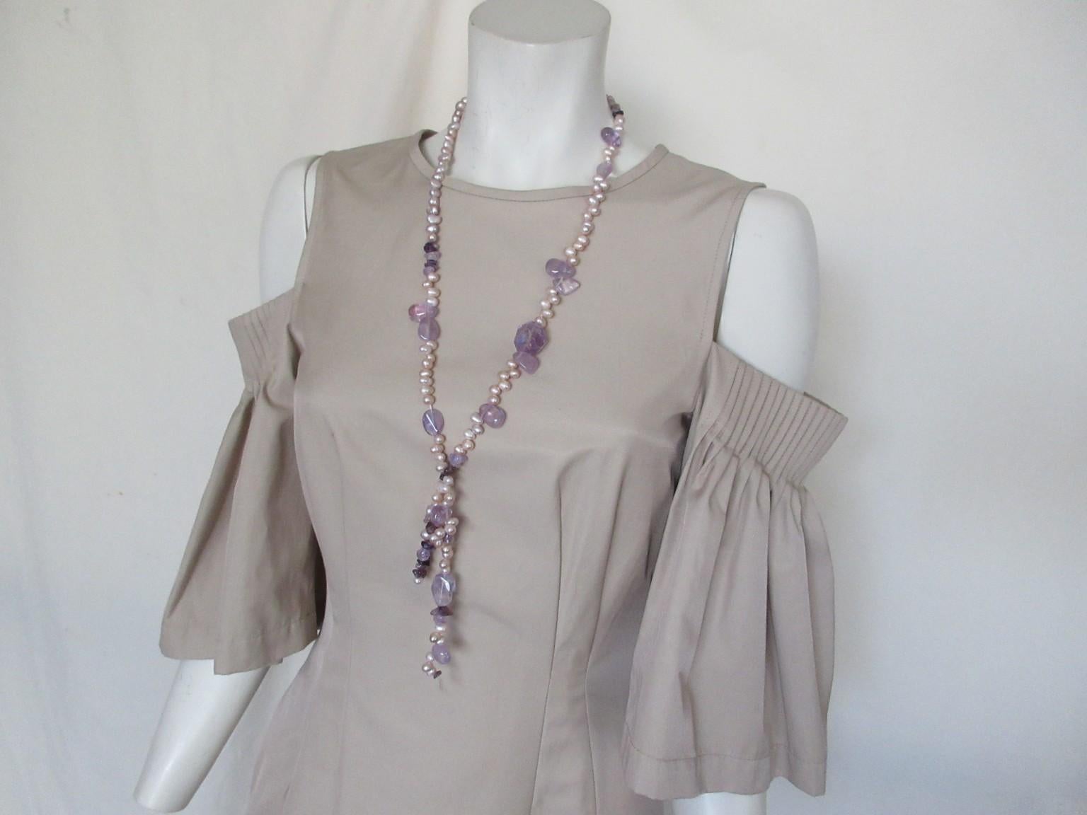 This beach/cocktail/party dress is designed by KARL LAGERFELD the former Chanel designer.

We offer more exlusive vintage items, view our frontstore

Details: 
With 2 side pockets
Back closing zipper and
little hook at the top
Color: