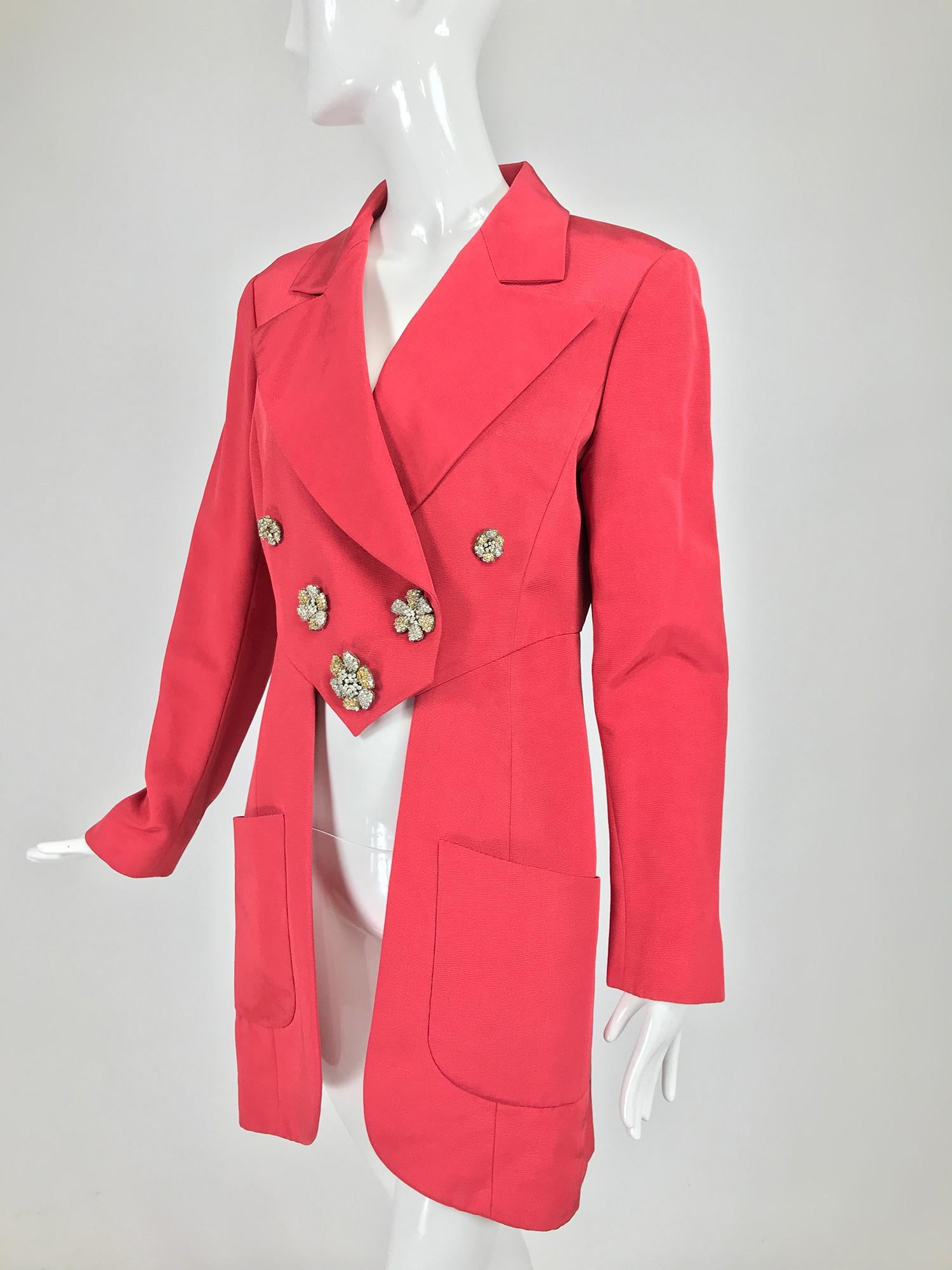 Karl Lagerfeld coral red silk faille reddingote style coat from the 1990s. This amazing coat is done in a beautiful shade of coral, the jacket front has princess seams, with double breasted closing and wide lapels. The jacket closes with hidden