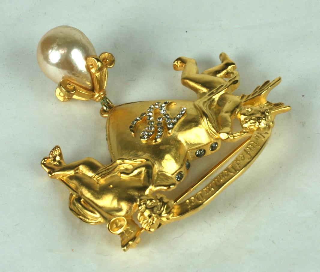 Karl Lagerfeld Cupid Heart Brooch from the 1990's.  A pair of cupids flank a matte gold heart with pave 