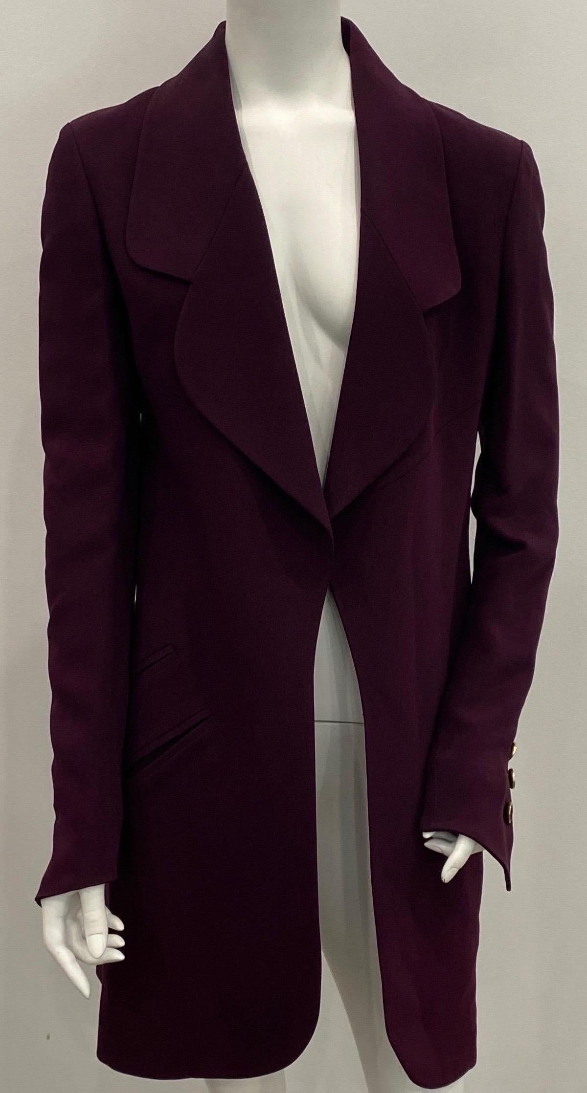 Karl Lagerfeld Eggplant 3/4 Coat - Size 36 This long jacket/Three quarter coat is a beautiful Eggplant Color. The jacket has large lapels, 2 front slit style functional pockets on each side, a back slit, 3 Fabric/Gold decortative buttons on each