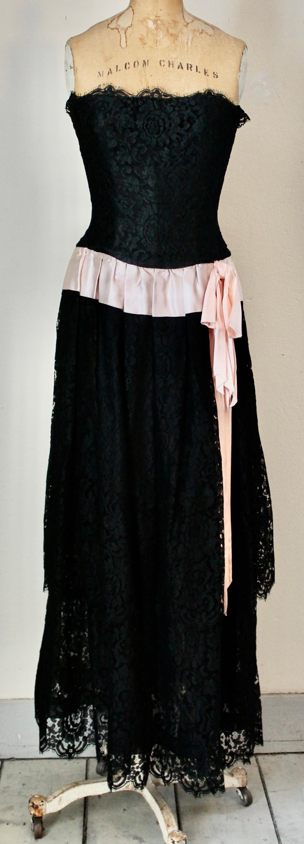 Karl Lagerfeld for Chanel Collection Croisière '84. Black floral motif lace Evening Gown with pink satin sash, fully lined.