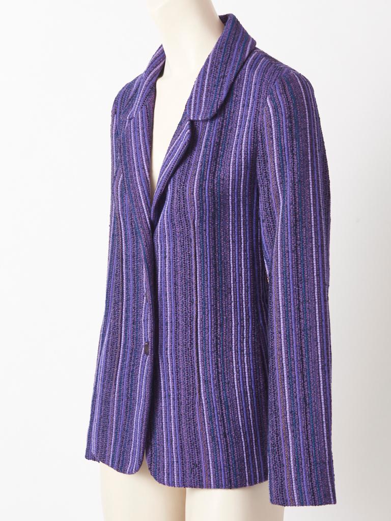 Karl Lagerfeld, for Chanel purple tone, vertical stripe, wool tweed, 3 button, semi fitted blazer with hidden slash pockets at the hips and a small lapel. There is a subtle lurex in the tweed and a subtle vertical copper chain detail appliqued on