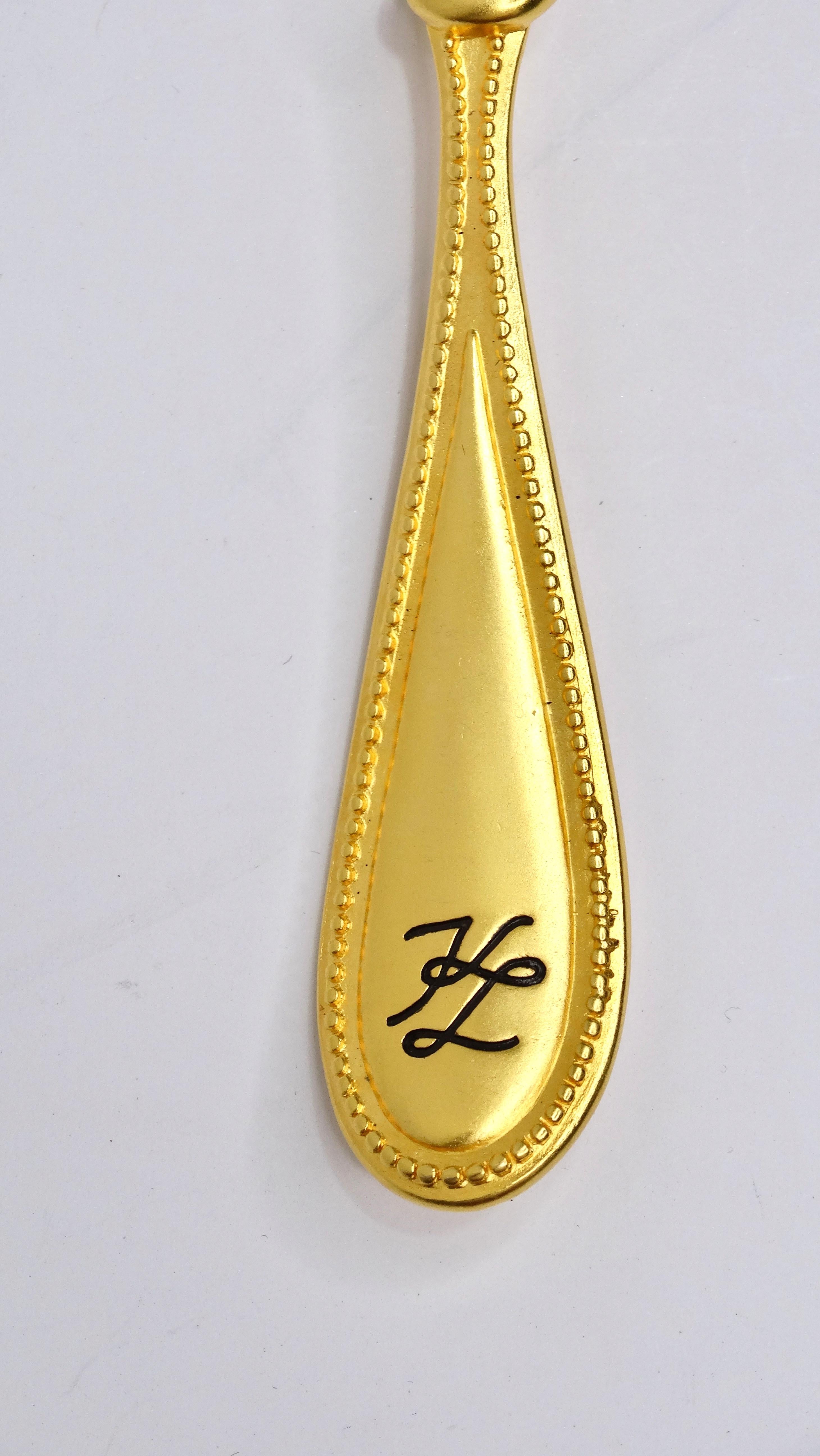 This is a spectacular brooch from the one and only Karl Lagerfeld! Calling all cooks and food lovers, this is the brooch for you! This is a rare collectors piece you need to get your hands on! Karl Lagerfeld creates a culinary delight with this