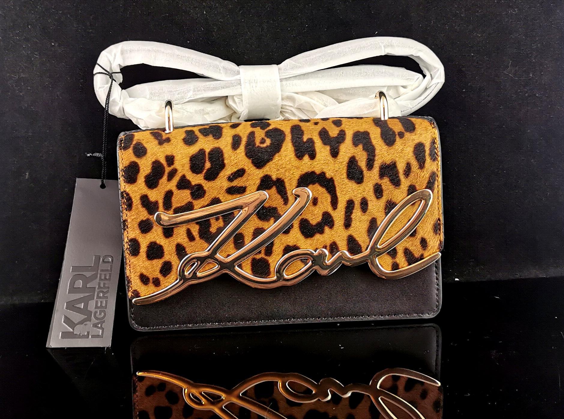 A gorgeous Karl Lagerfeld K / signature bag.

It has a long shoulder handle, this has not been unwrapped and still retains the tissue paper, can be worn Crossbody or shoulder.

It has a leopard print faux fur top flap with a magnetic stud fastener,