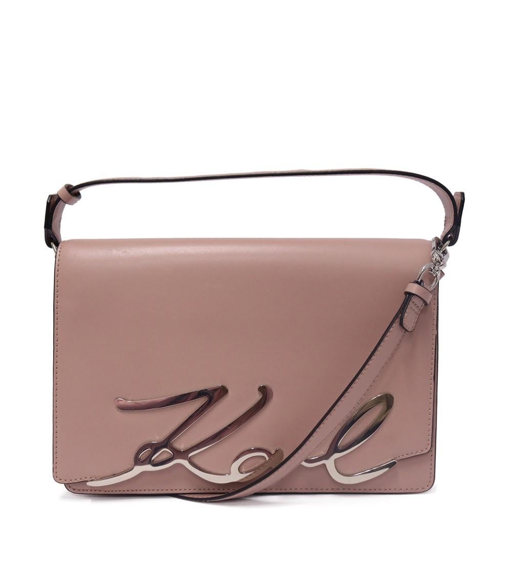 Karl Lagerfeld K/Signature Top Handle Bag, features a top handle, adjustable/ removable extra strap and three interior pockets.

Material: Leather
Hardware: Silver.
Height: 21cm
Width: 28cm
Depth: 7cm
Handle Drop: 8cm
Overall condition: