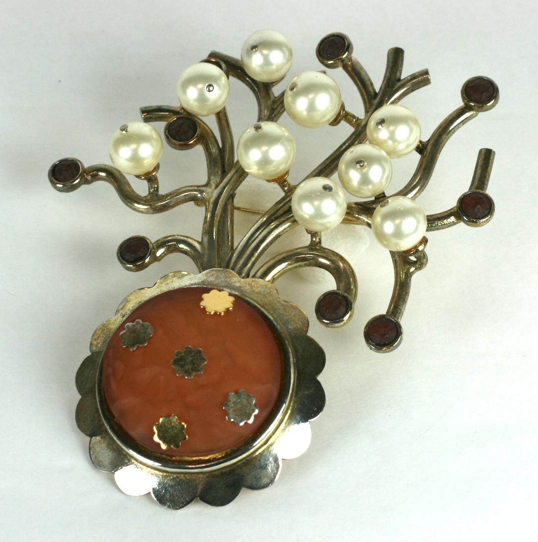 Amazing, Rare Karl Lagerfeld Massive Silver toned Bonsai Tree Brooch from the 1980's. Huge in scale with faceted resin pot studded with gold and silver floral motifs. The branches are studded with large faux pearls and resin cabochons.
Early 