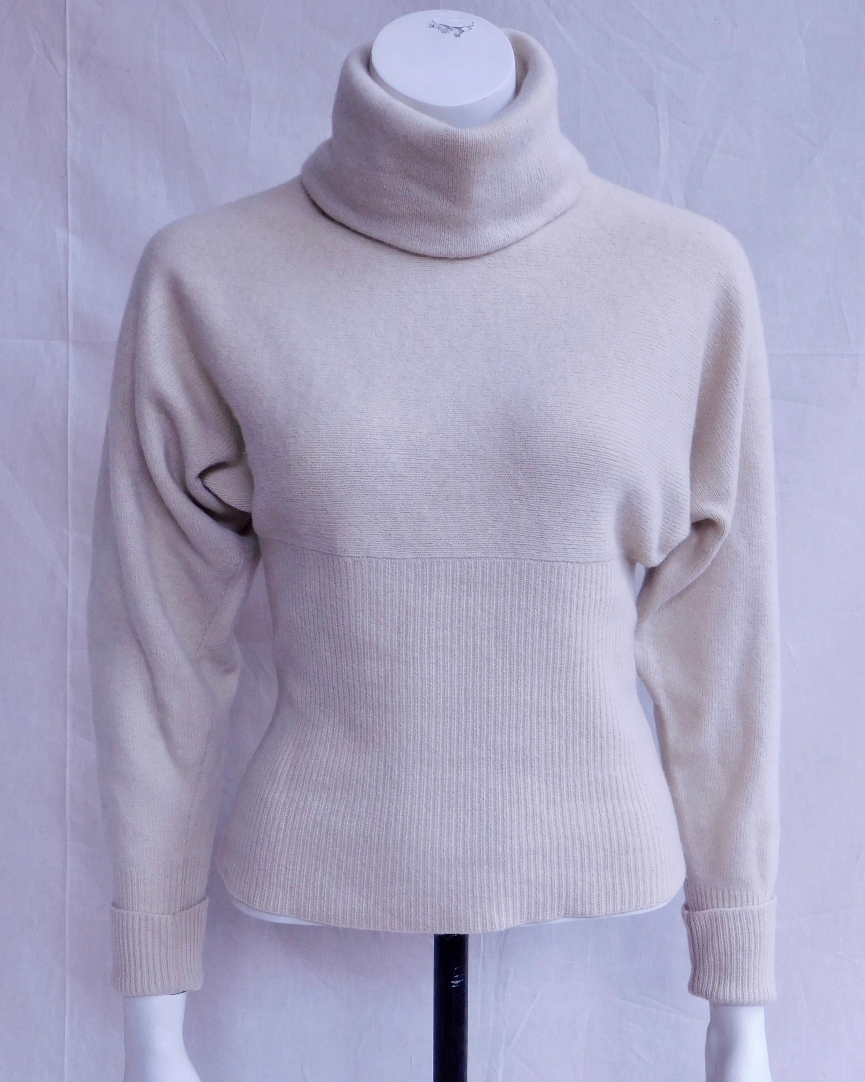 Elegant and timeless off white Karl Lagerfeld turtleneck sweater in double ply cashmere . Marked as a size 36(4) but the design is very flexible and easily fits a 36-40 ( USA 4-8)
Knit horizontally instead of vertically this sweater keeps its shape