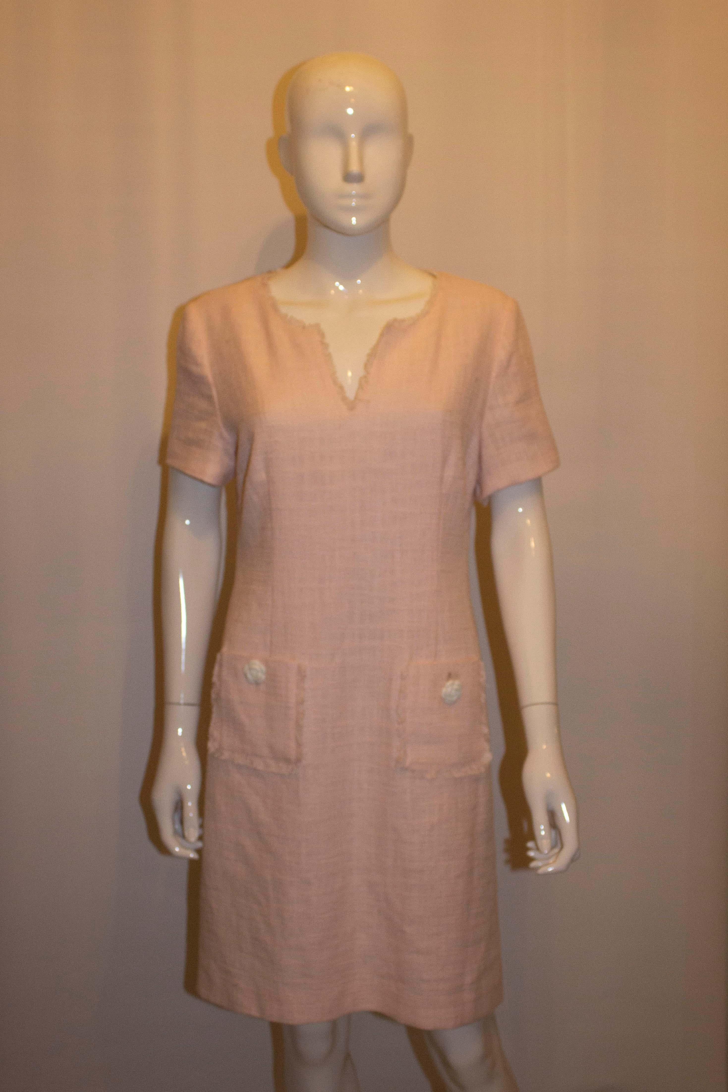 A pretty pink shift dress by Karl Lagerfled, Paris line. The  dress is in a pretty shade of pink, and has two pockets on the front , shorts sleaves and  is fully lined. 
Size 10, measurements : bust up to 38'', length 37''