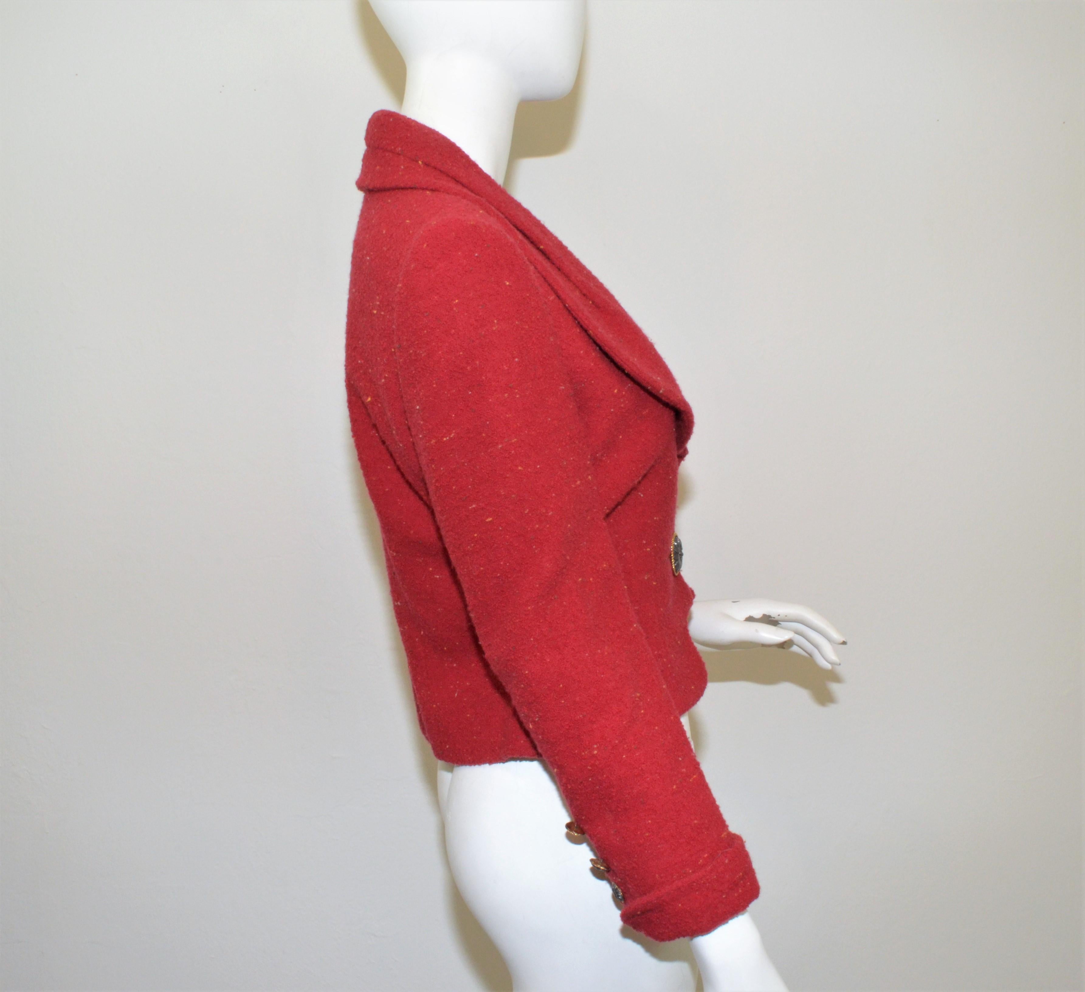 Vintage Karl Lagerfeld cropped jacket featured in a red-maroon color with a single button closure and buttons at the cuffs of the sleeves. Jacket is fully lined, composed with wool and polyester, labeled size 40, made in France.

Measurements:
Bust