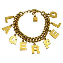 KARL LAGERFELD Vintage Gold Tone Lettering Charm Bracelet