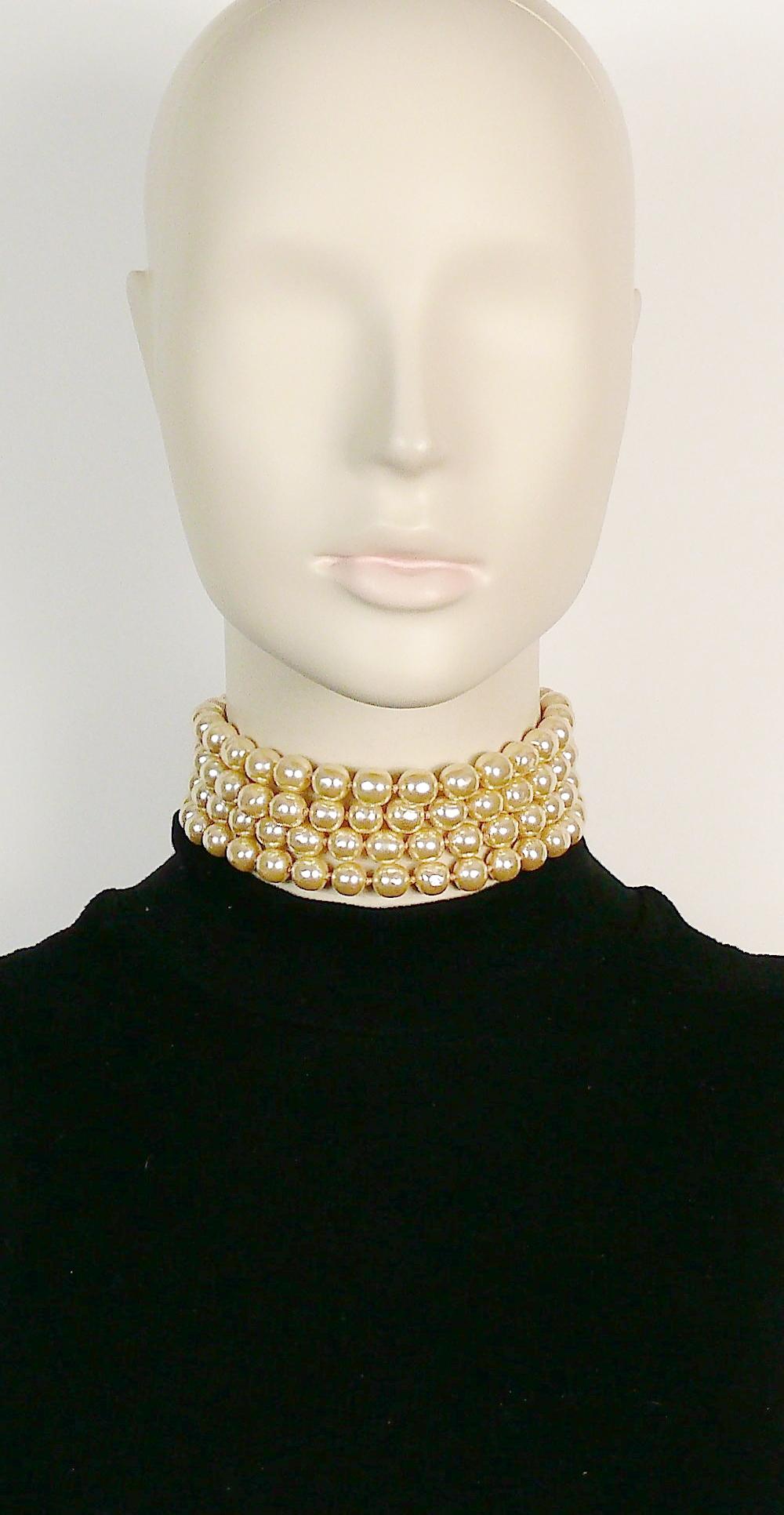KARL LAGERFELD vintage four tiered off-white glass pearl strands choker necklace.

Gold toned hardware.

Adjustable double hook closure.

Embossed KL.

Indicative measurements : adjustable length from approx. 32 cm (12.60 inches) to approx. 38 cm