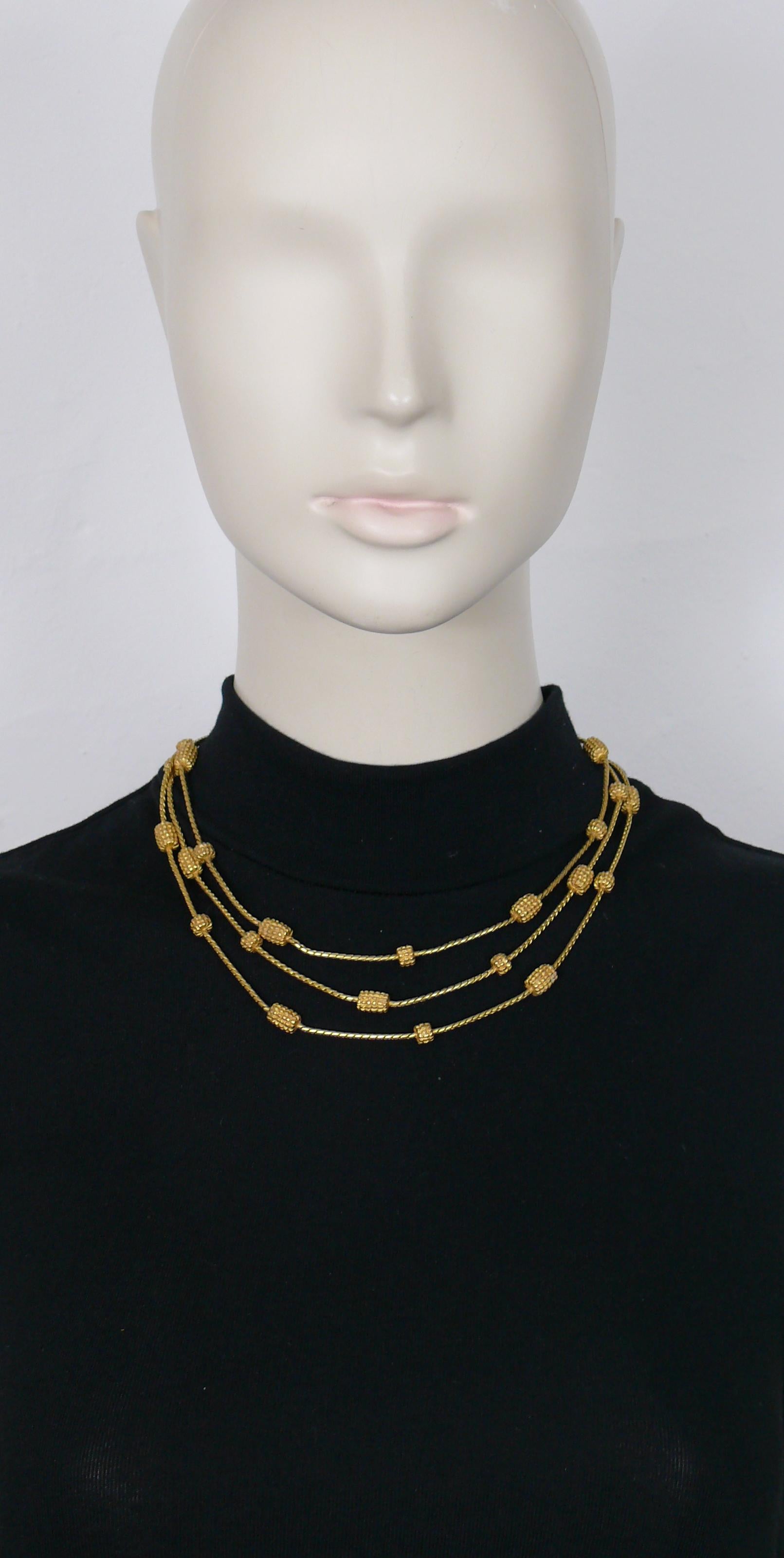 KARL LAGERFELD vintage gold toned 3-strand necklace.

Hook clasp closure.
Adjustable length.

Embossed KL.

Indicative measurements : adjustable length from approx. 41 cm (16.14 inches) to approx. 47 cm (18.50 inches).

NOTES
- This is a preloved