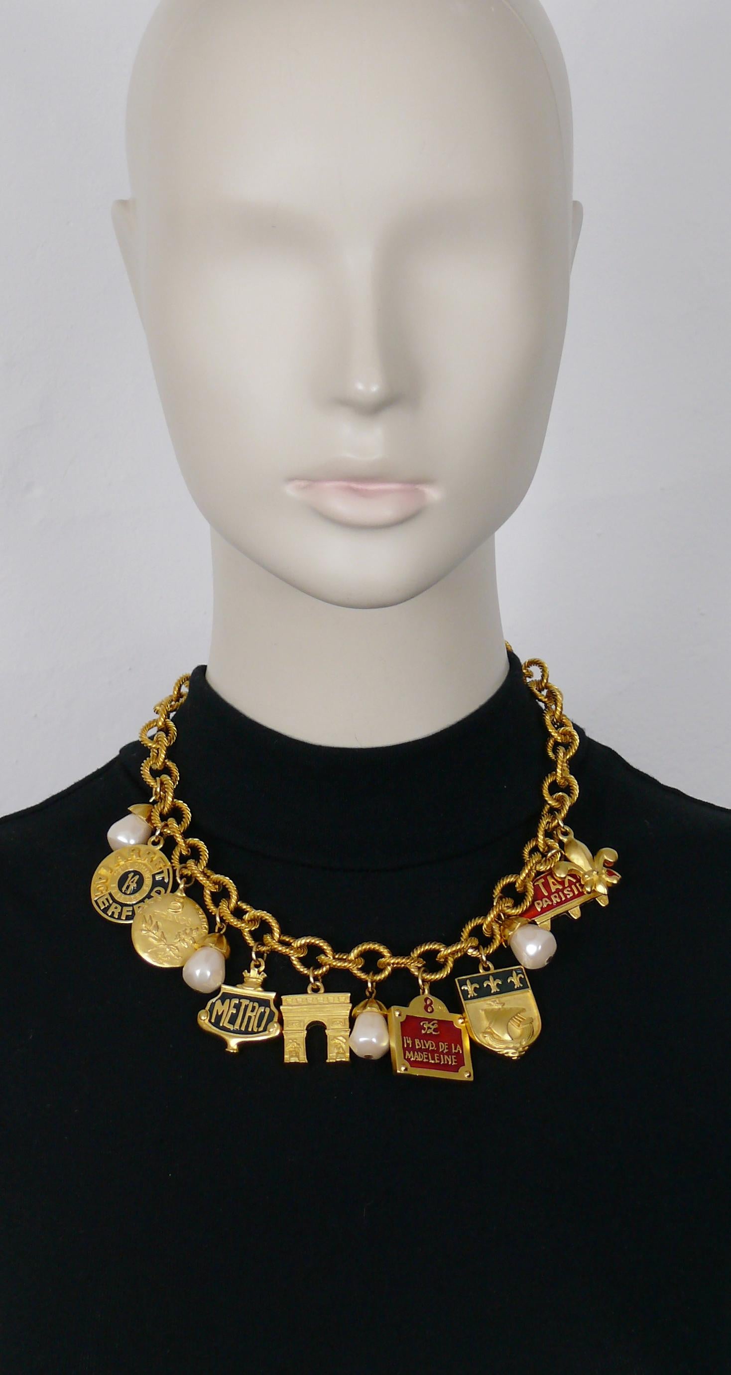KARL LAGERFELD vintage gold tone chain necklace featuring Paris tribute charms and faux pearls (resin).

Adjustable lobster clasp closure.

Marked KL.

Indicative measurements : adjustable length from approx. 43 cm (16.93 inches) to approx. 48 cm