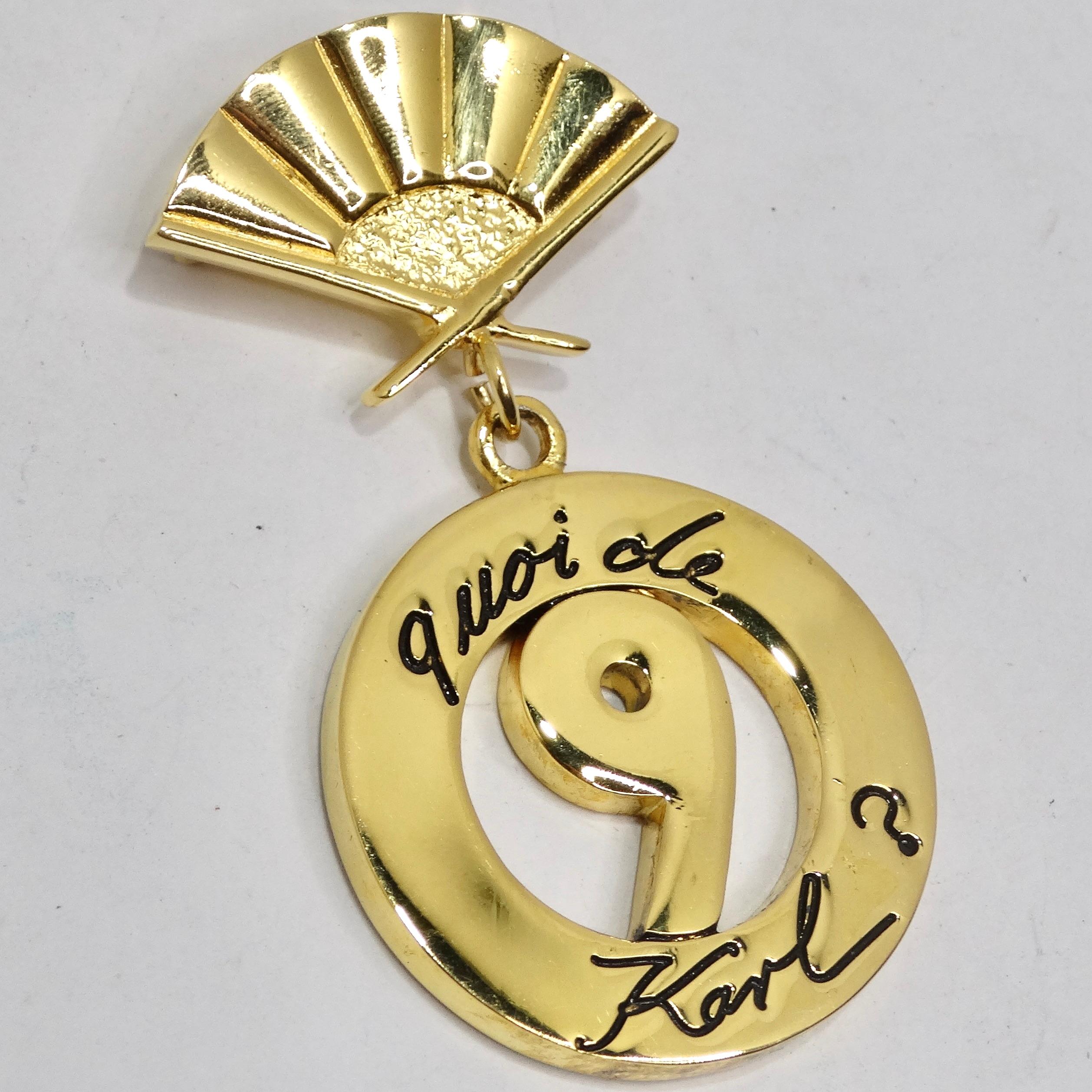 Embrace iconic elegance with the Karl Lagerfeld 1980s 'Quoi de 9 Karl?' Fan Pearl Drop Brooch – a statement piece that pays homage to the legendary designer. This brooch features the iconic fan with an openwork medallion drop, engraved with the