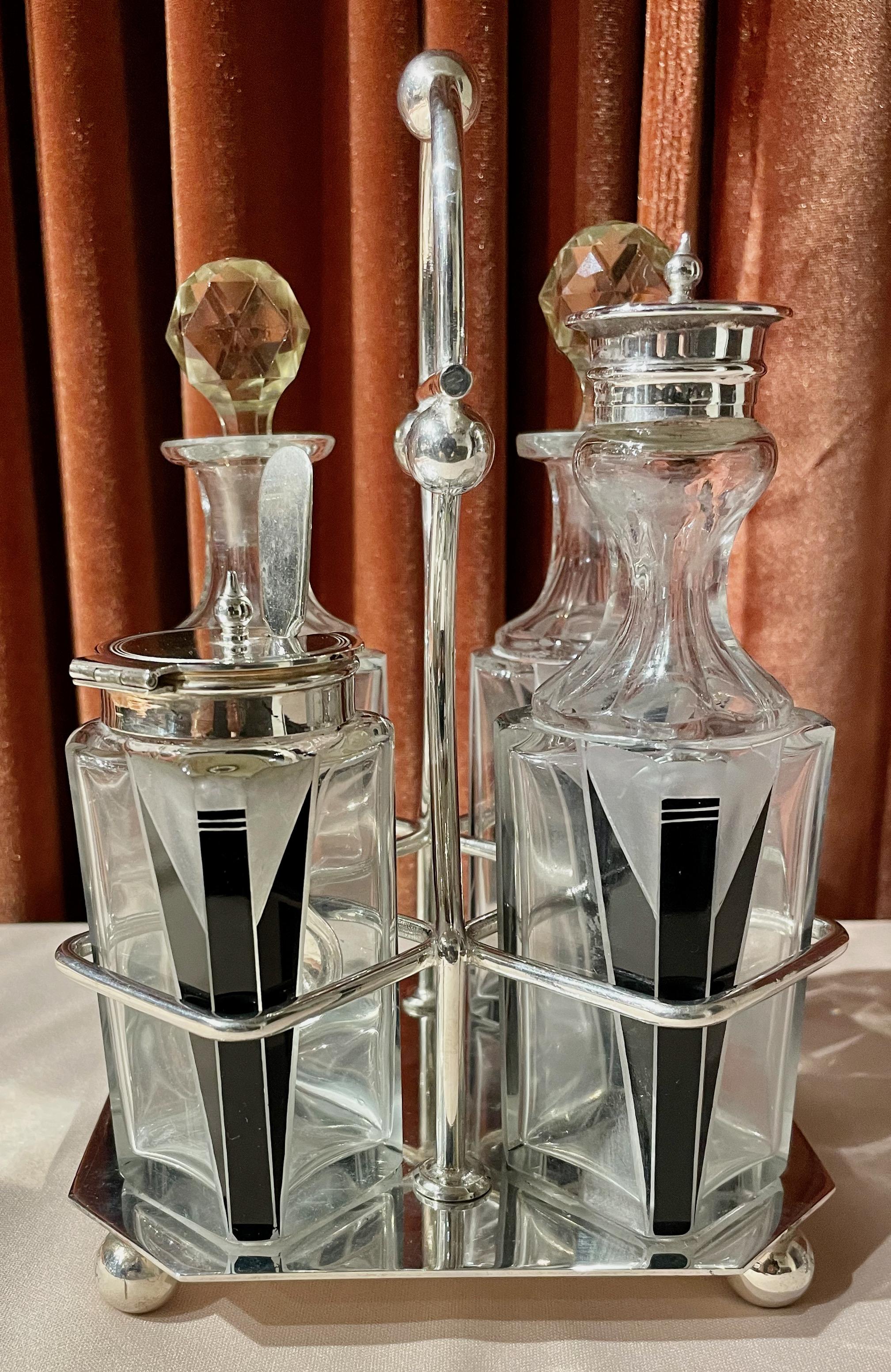 Karl Palda Czech Modernist 5 piece Tableware Cruet set. Spectacular example and a rare cruet set. All pieces are in excellent condition. Also, included is a spoon for jam jar or? Oil & Vinegar with crystal faceted top closers and original tops for