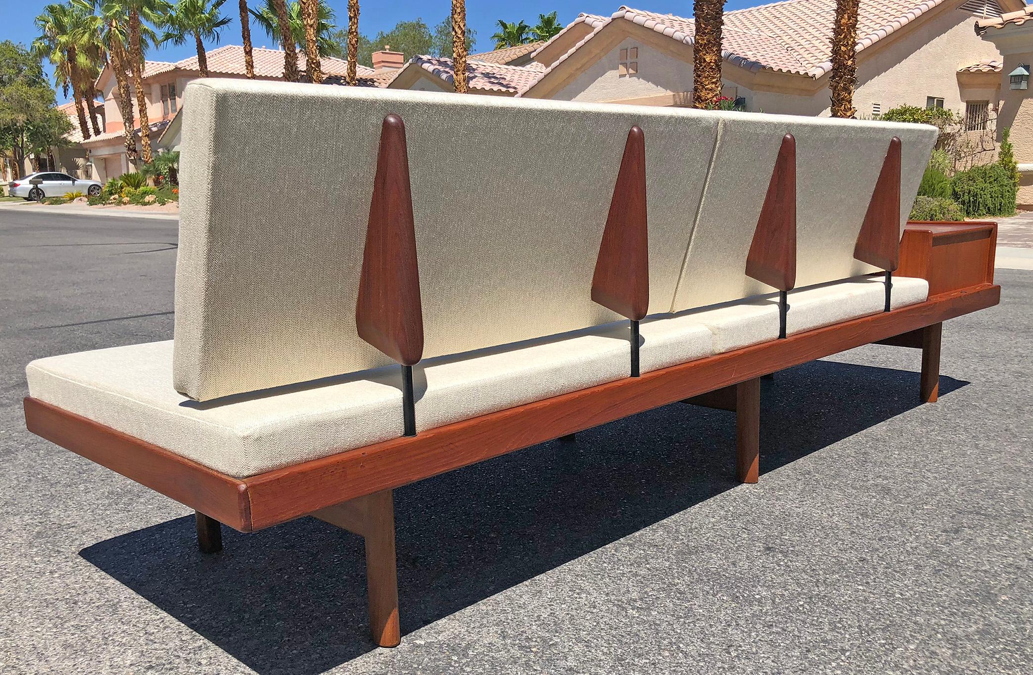 This Mid-Century Modern, Norwegian sofa is just as functional as it is beautiful. The piece features a teak frame with floating and modular features (as photographed). The frame allows for the sofa to be configured in multiple ways by simple pulling