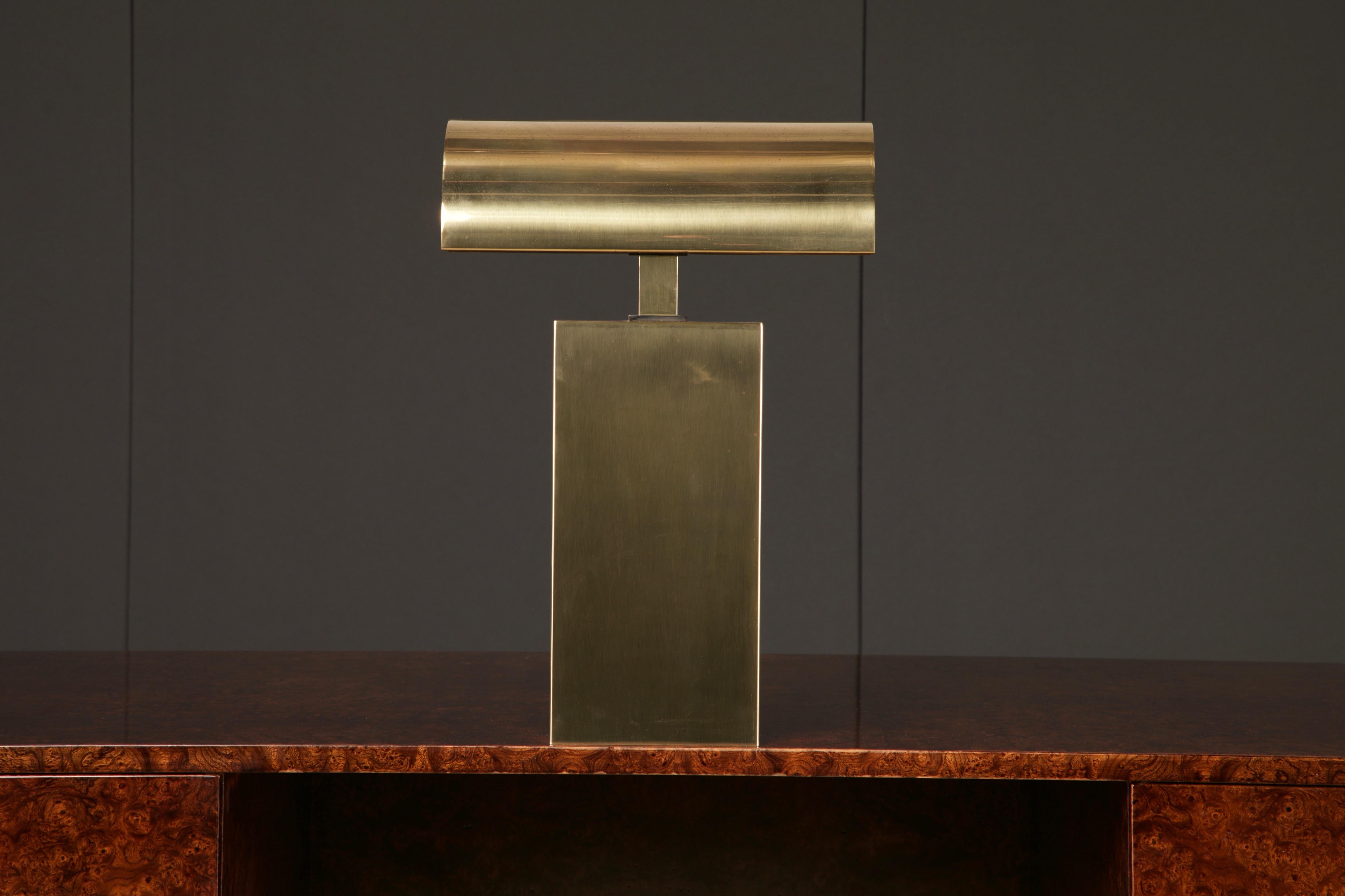 Elegantly crafted, this rare 'Sculpture' table lamp by Karl Springer embodies the essence of his meticulous artistry. This example is fashioned from hefty brass, crafted in the 1980s and adorned with Springer’s signature on its base (see photos),