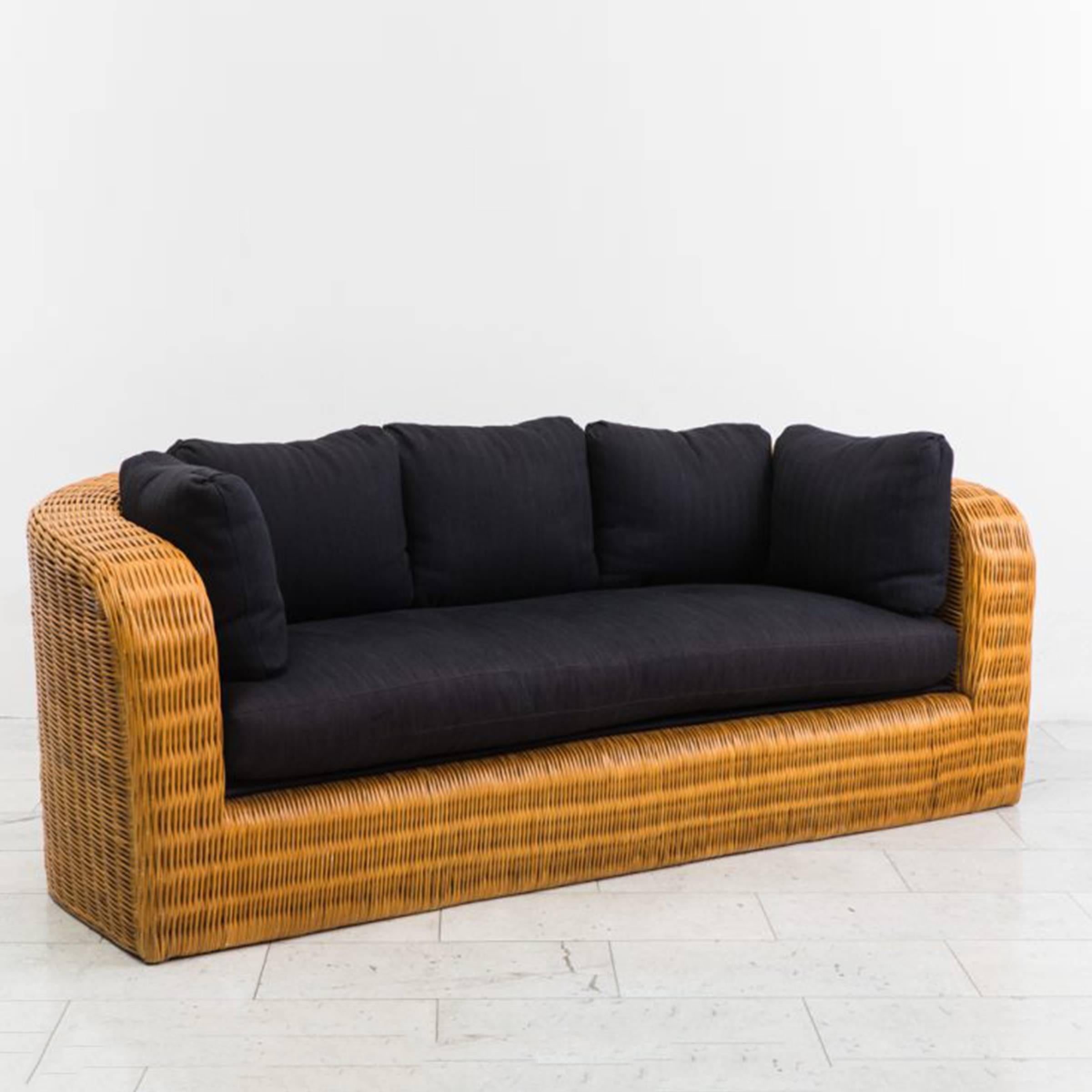 This gorgeous rounded-back Karl Springer Pullman Sofa was designed in 1985.  Constructed of bamboo and wicker the sofa features Springer’s penchant for simple, elegant lines, excellent craftsmanship and a modern aesthetic.

Dimensions: 31h x 85w x