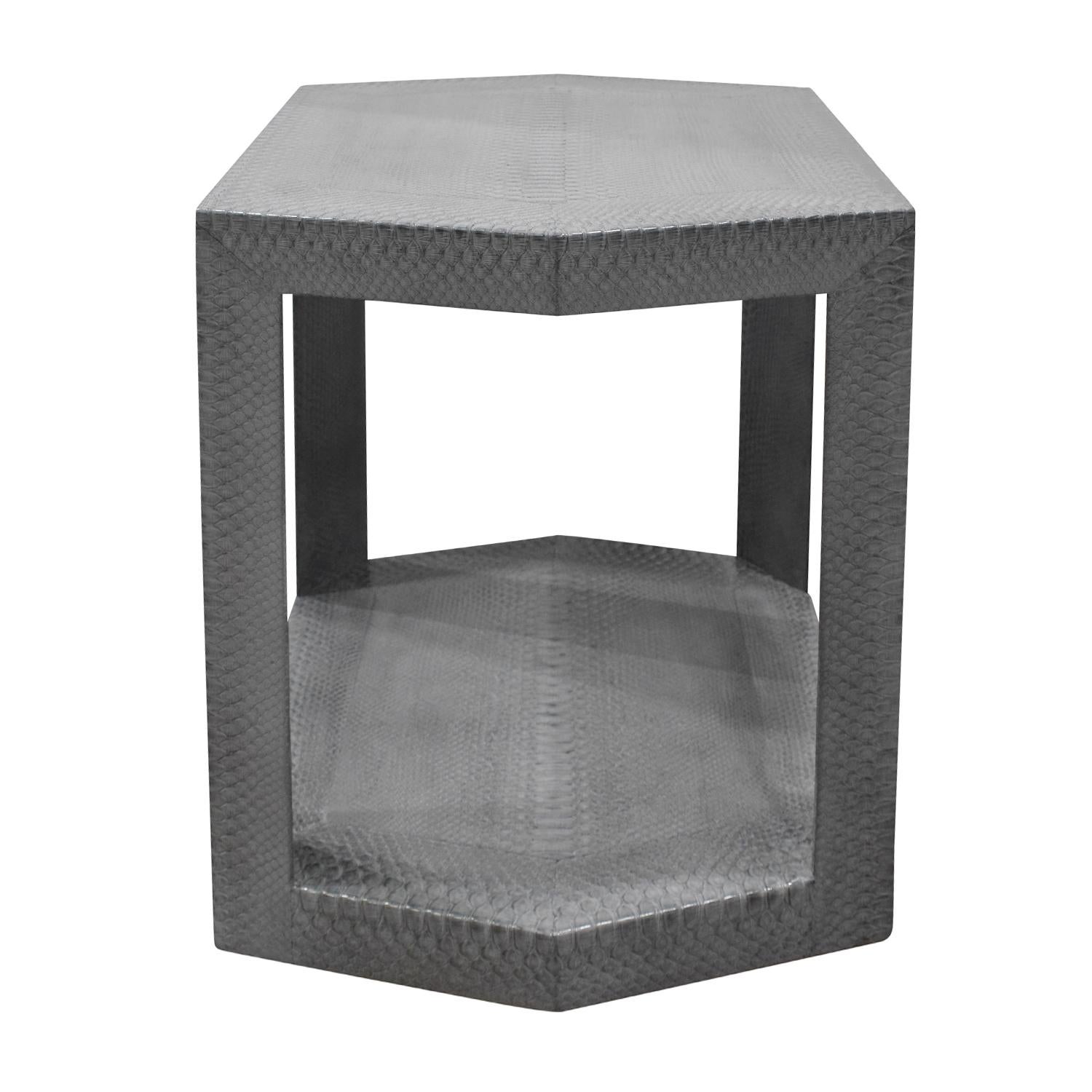 2 tier hexagonal side table in gray cobra by Karl Springer, American 1985 (label on bottom reads “Karl Springer 1985”). Bottom is covered in moire silk. The craftsmanship of this table is extraordinary.