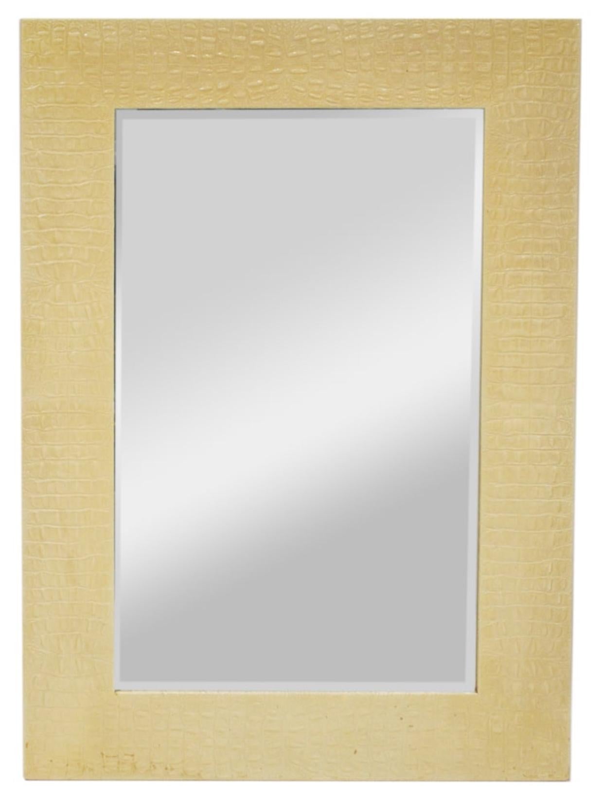 Large and impressive, Alligator embossed leather wrapped 52”T x 36”W wall mirror by Karl Springer. 

This luxurious mirror came from the home of Susie Hillfiger, wife of Tommy Hilfiger, and the curator of the Hilfiger Collection. It’s difficult to