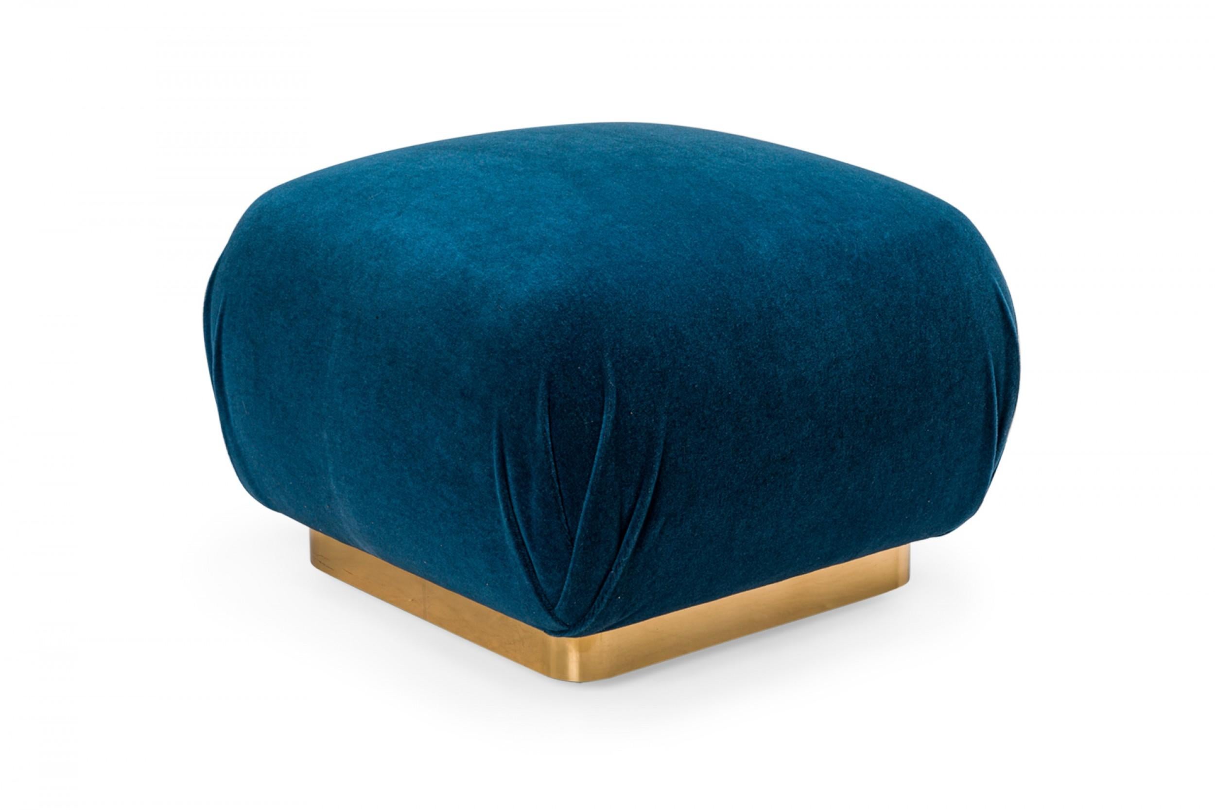 American mid-century 'Souffle' ottoman with blue velvet upholstery with a square gilt steel base. (Karl Springer)