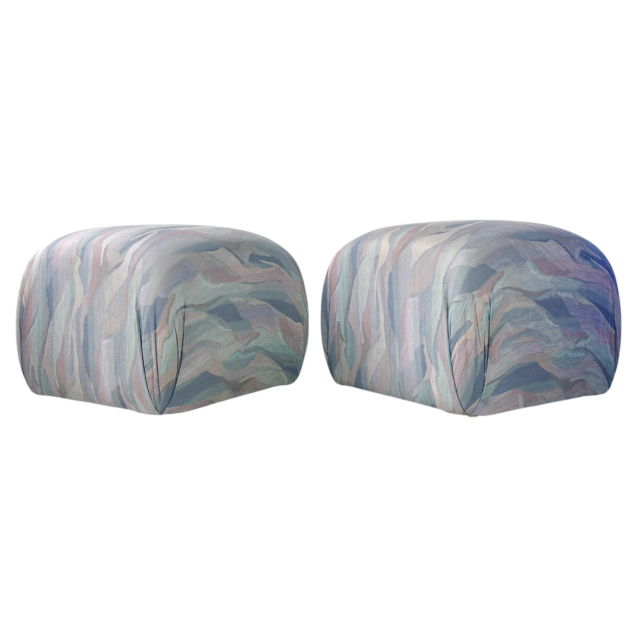 Vintage circa 1980s Karl Springer attributed soufflé pouf ottomans. Cube shaped with rounded edges and in original found fabric. Fabric has shades of pink, blues and greens.