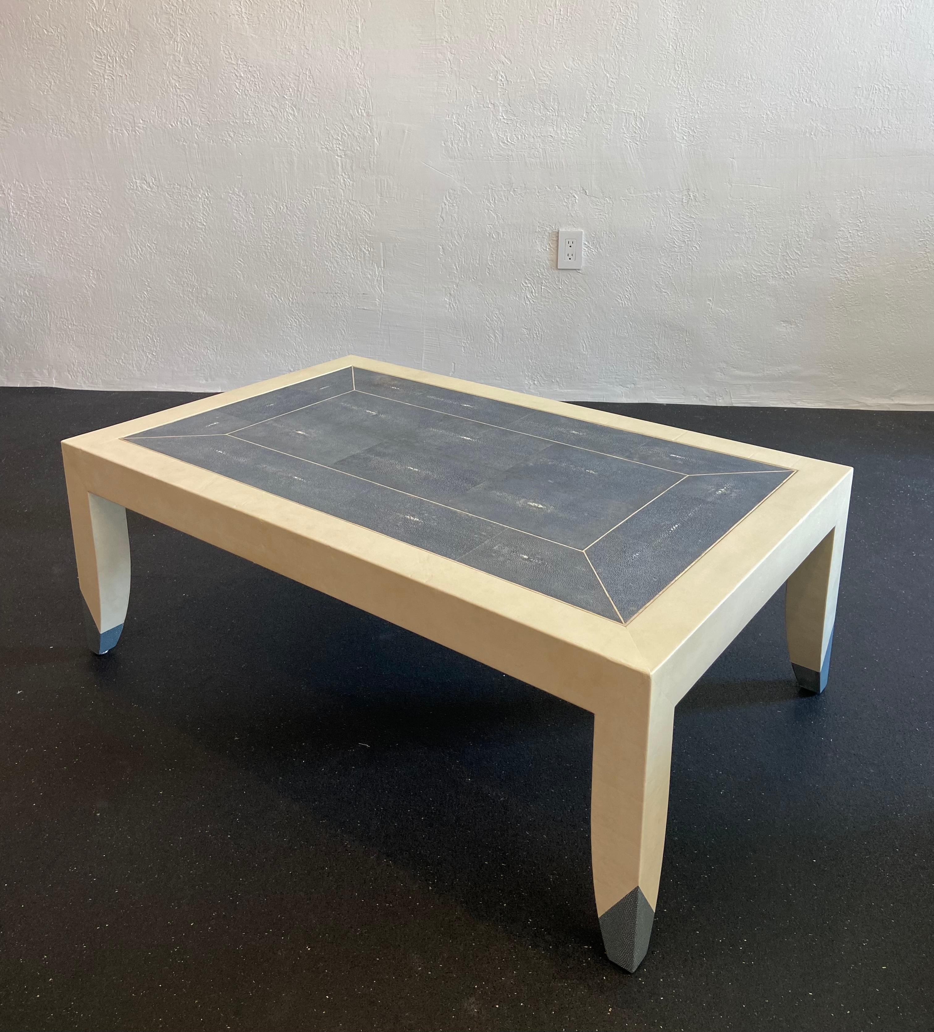 Karl Springer shagreen and leather wrapped coffee table. Signed and dated. Blue tinted shagreen. Gray version available on separate listing. Extremely rare example. Wear to the leather and shagreen (please refer to photos).

Would work well in a