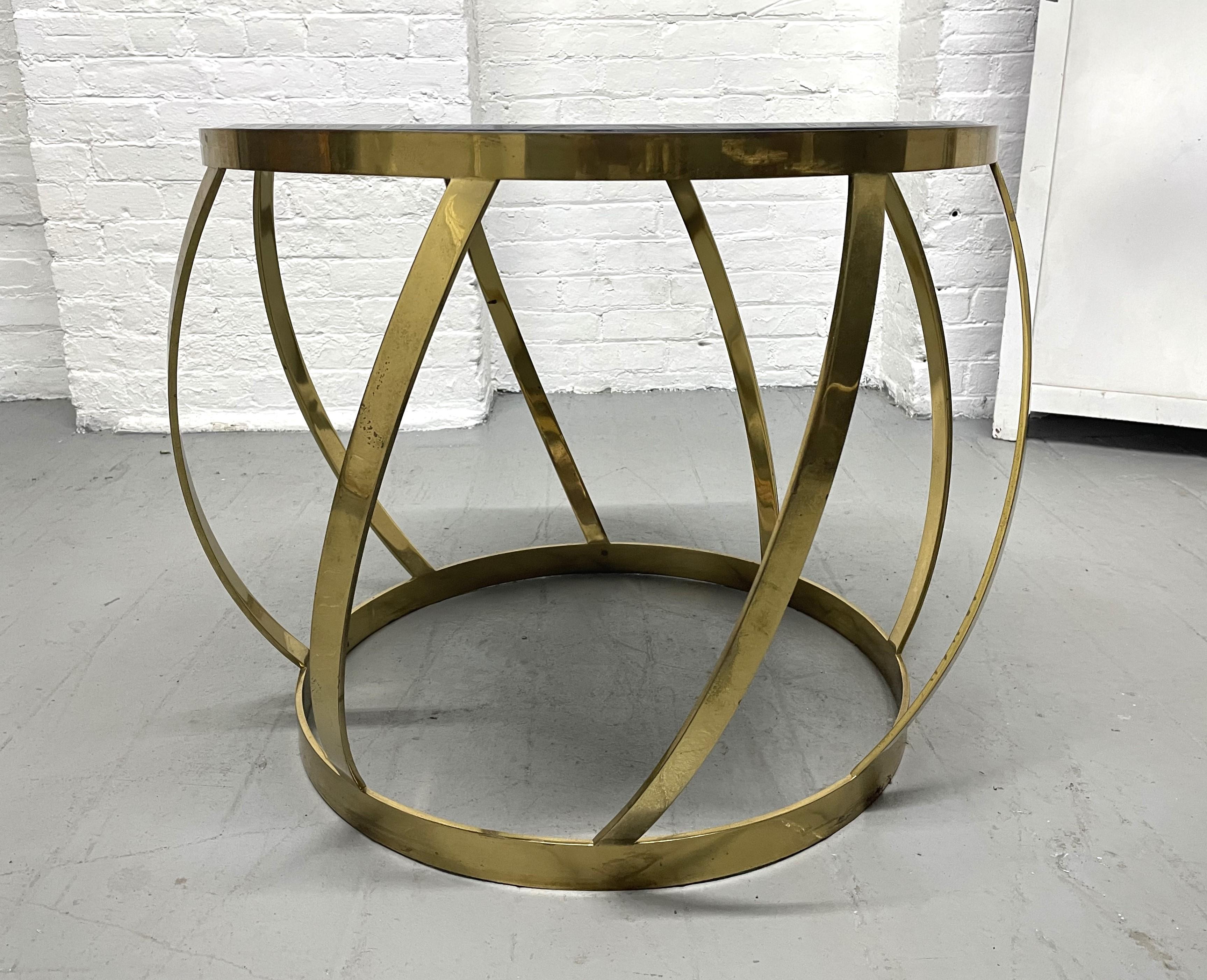 Rare oval onyx brass side table by Karl Springer. Heavy brass table with an onyx beveled insert top.