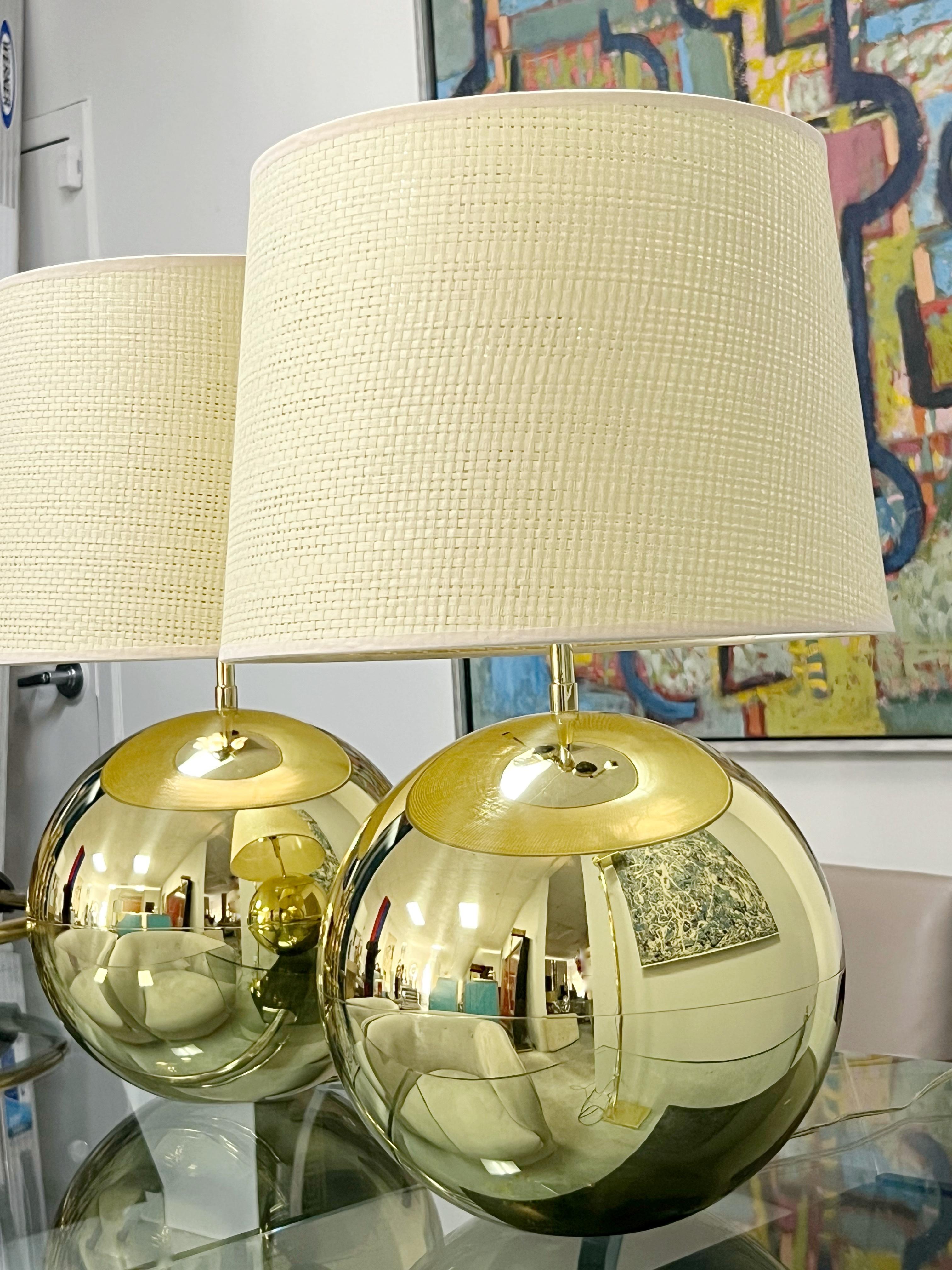 A pair of brass lamps by Karl Springer. Contemporary shades. 