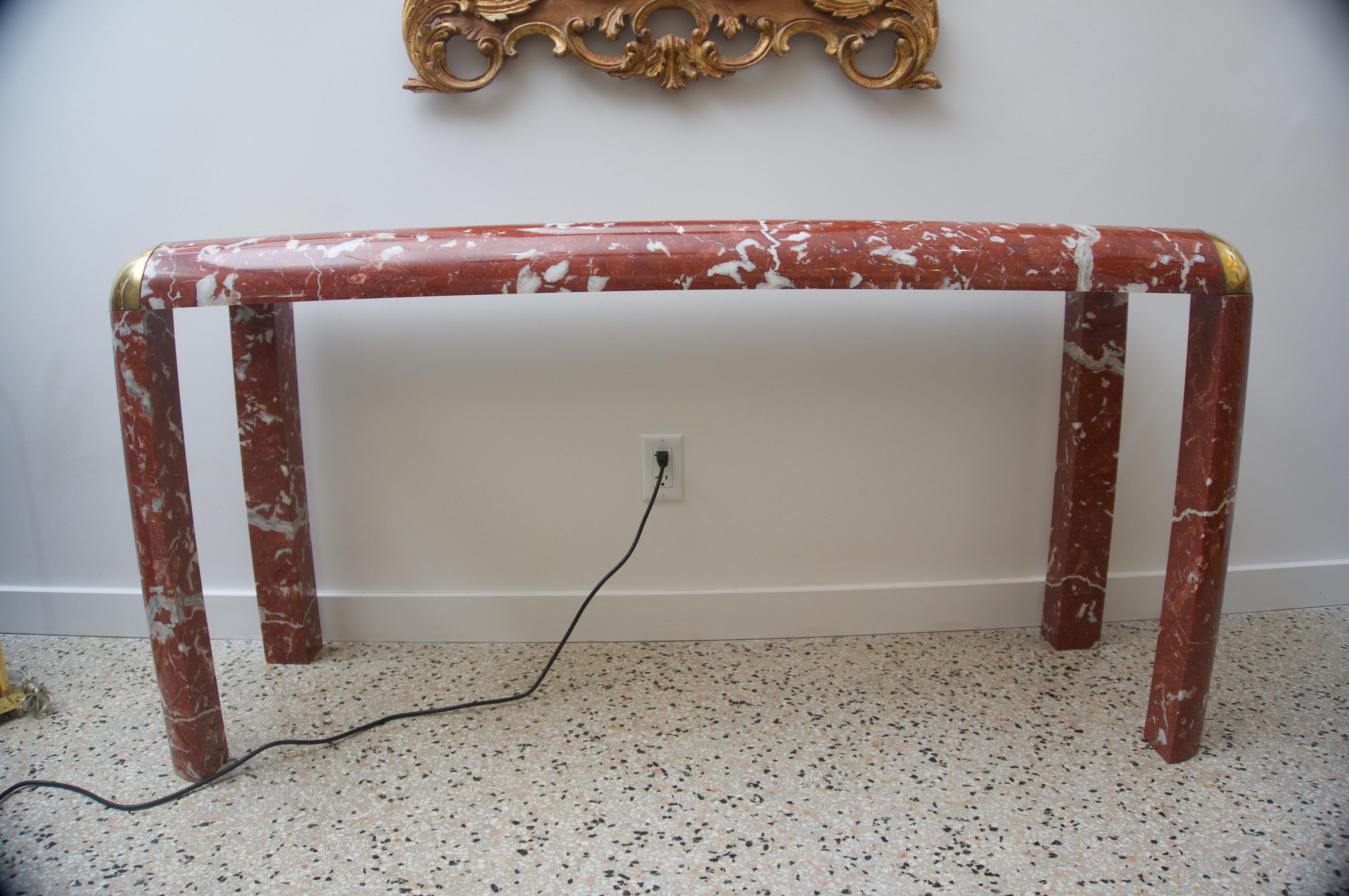 This stylish and chic breccia marble console table dates to the 1980s and is very much in the manner of piece created by Karl Springer. The piece was acquired from a Palm Beach estate and it will make a strong statement with its bold lines and use