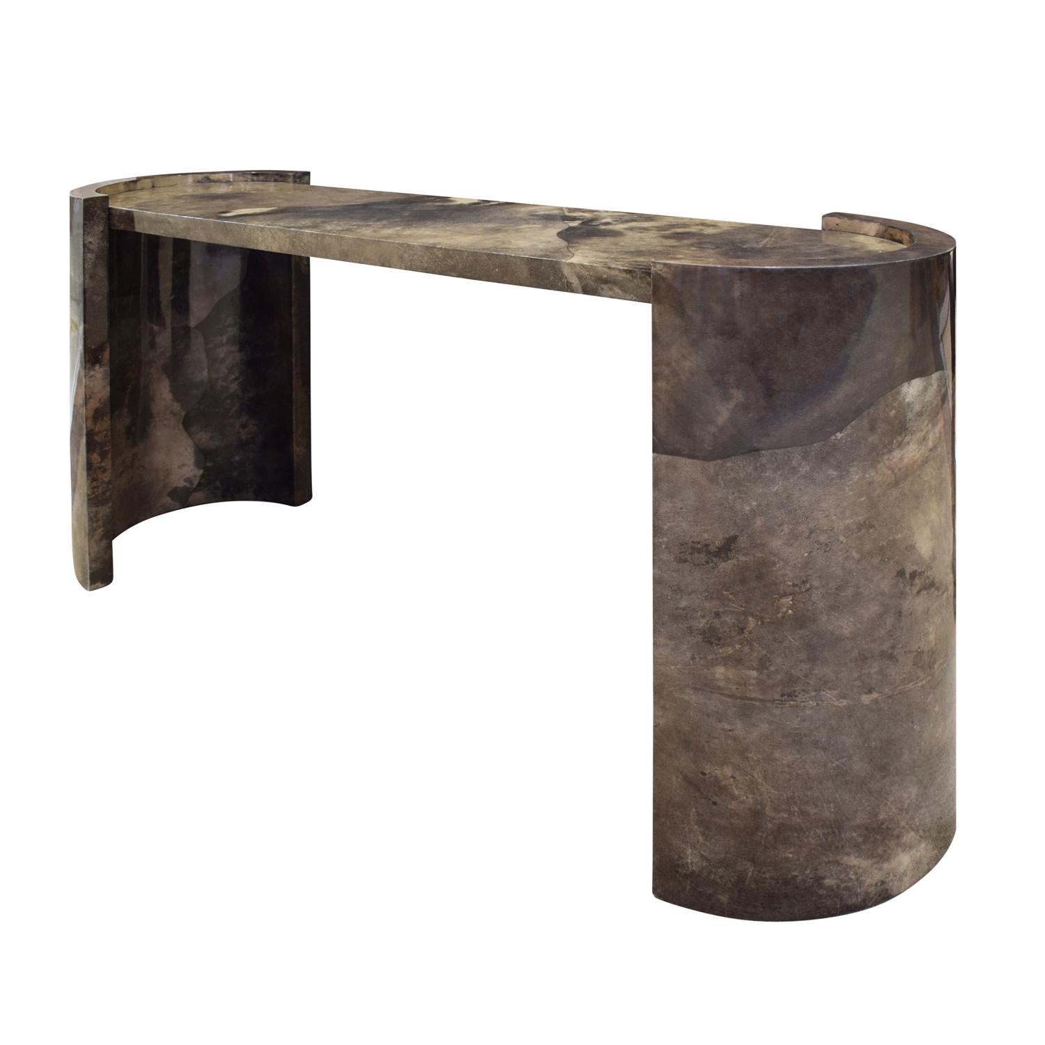 Impressive console table in taupe and brown mirror lacquered goatskin with racetrack top and curved sides by Karl Springer, American 1980. Dated on bottom.  This table exemplifies the impeccable craftsmanship of Karl Springer.  