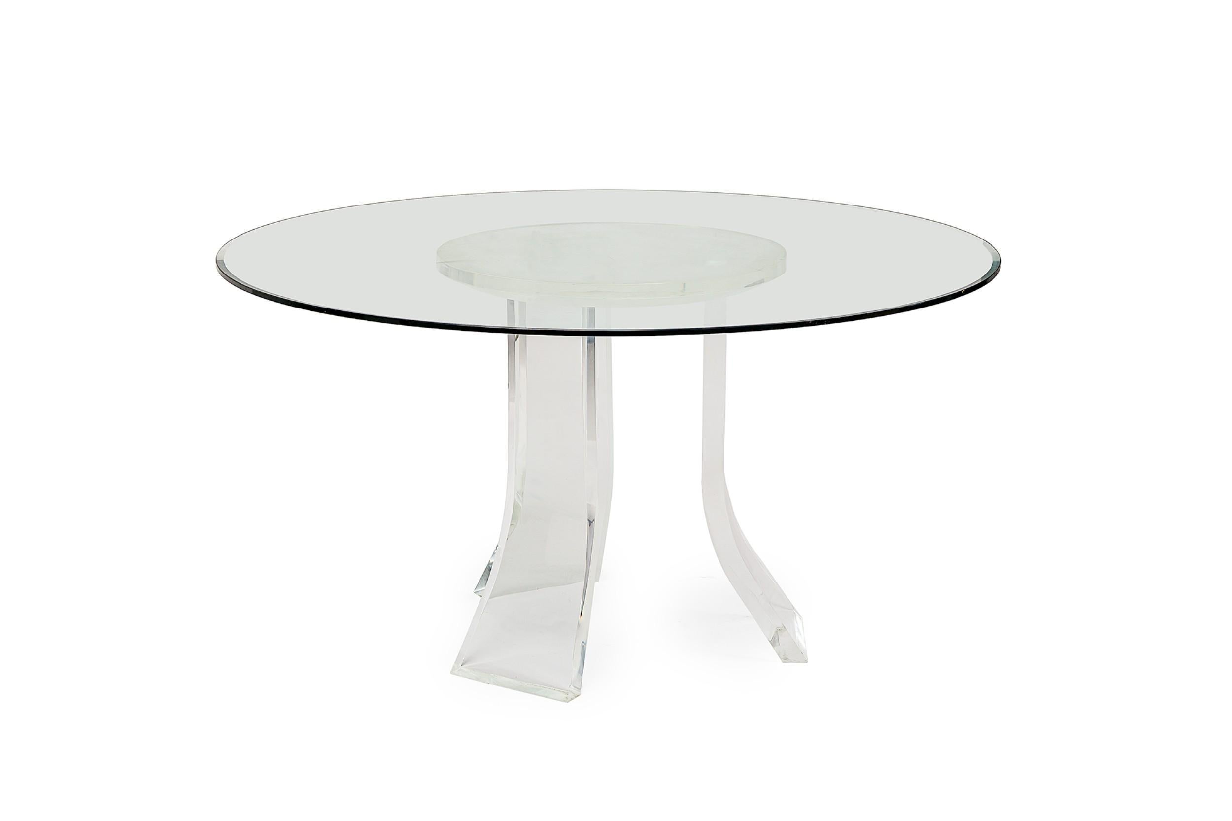Contemporary American dining / conference table base constructed from a circular piece of clear lucite with three wide flared legs. (KARL SPRINGER)

Some minor scuffs to lucite